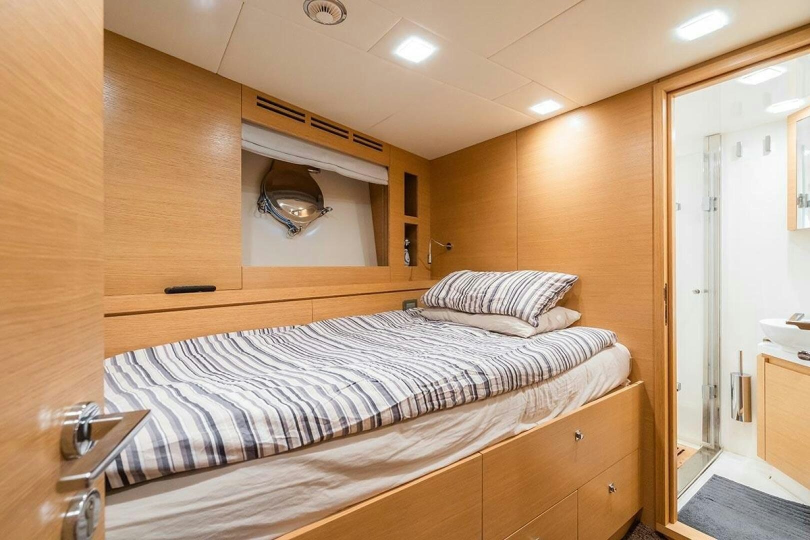 a bed in a room aboard ROCCO Yacht for Sale