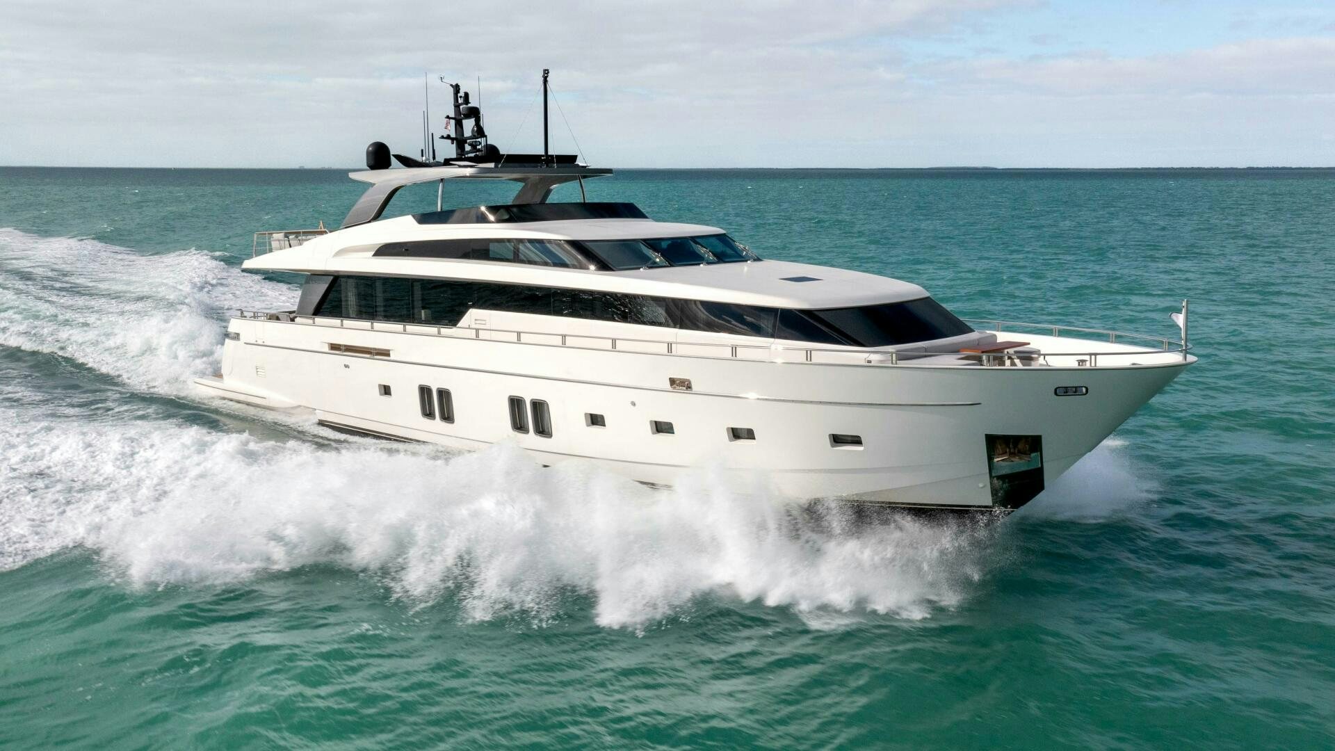 a white yacht on the water aboard HONEY POT Yacht for Sale