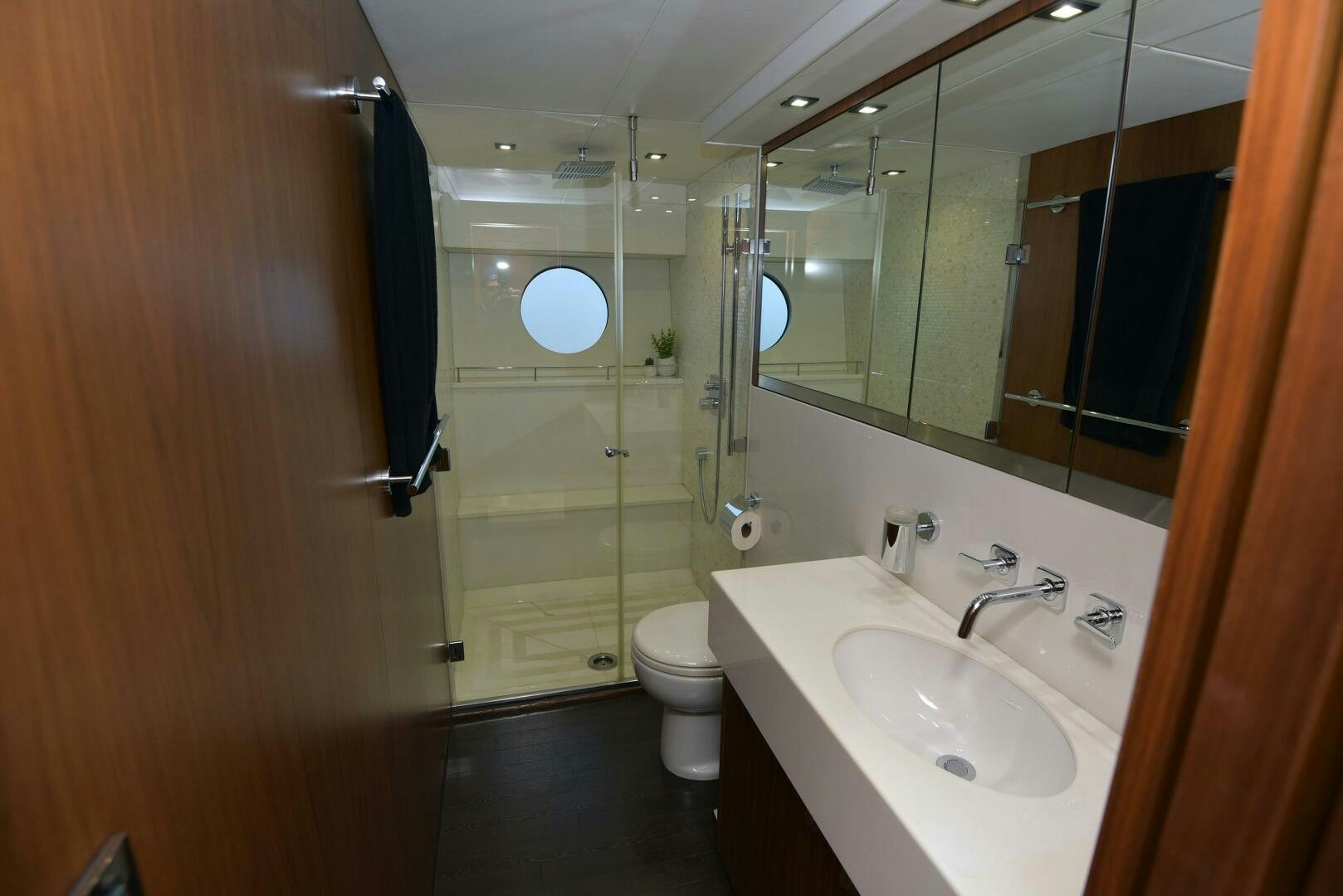 a bathroom with a glass shower door aboard SAVI II  Yacht for Sale