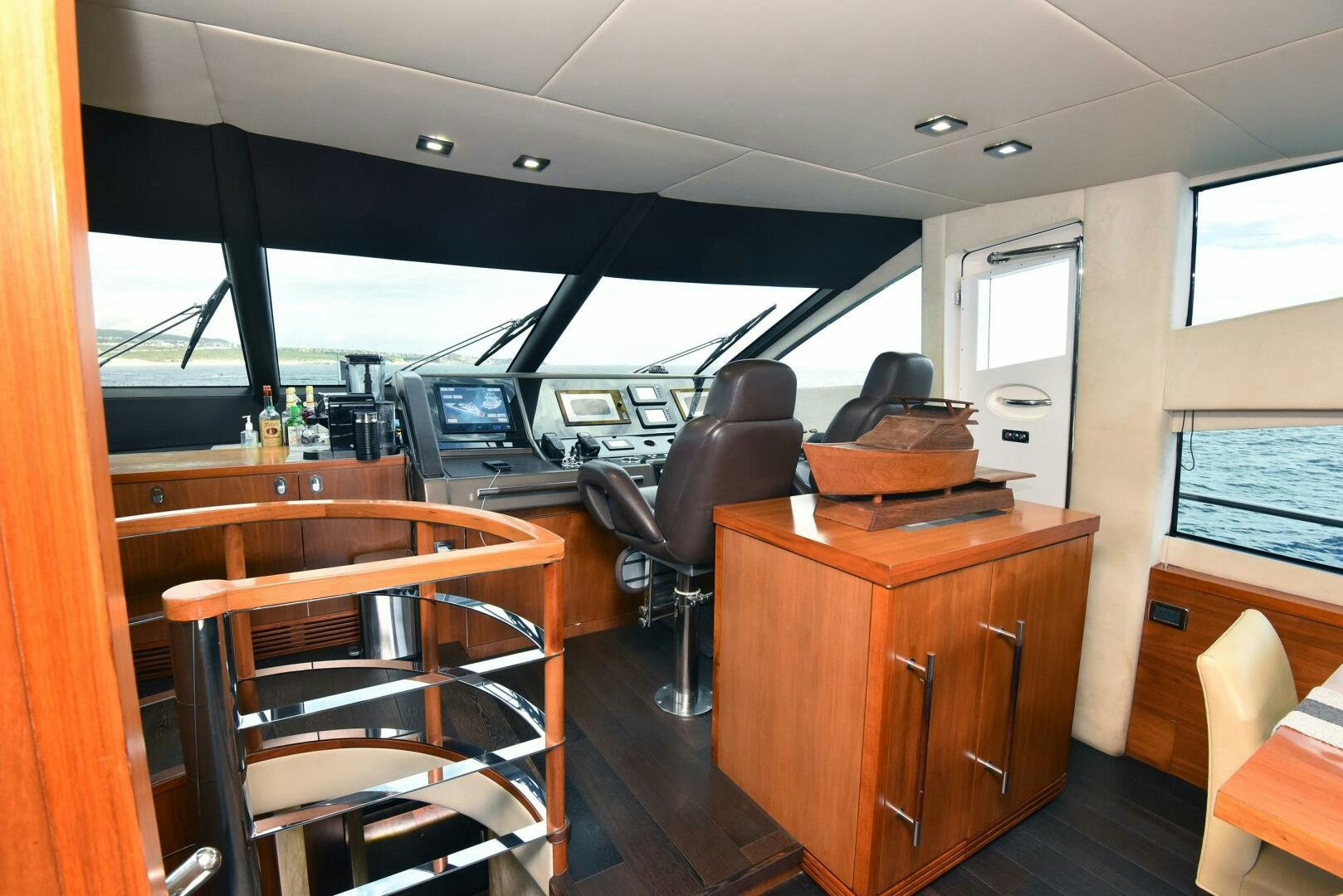 inside of a vehicle with desks and chairs aboard SAVI II  Yacht for Sale
