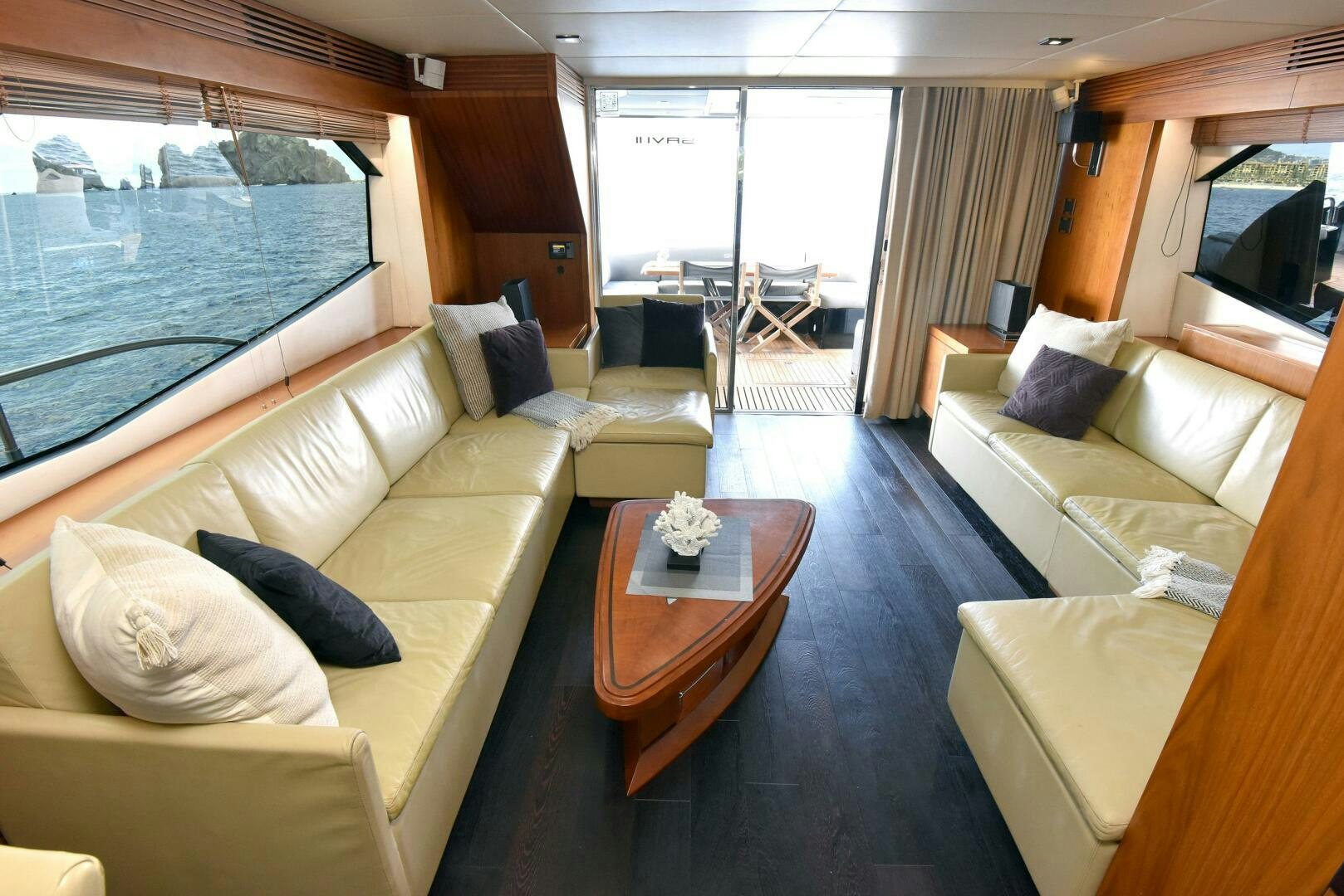 a living room with a large window aboard SAVI II  Yacht for Sale