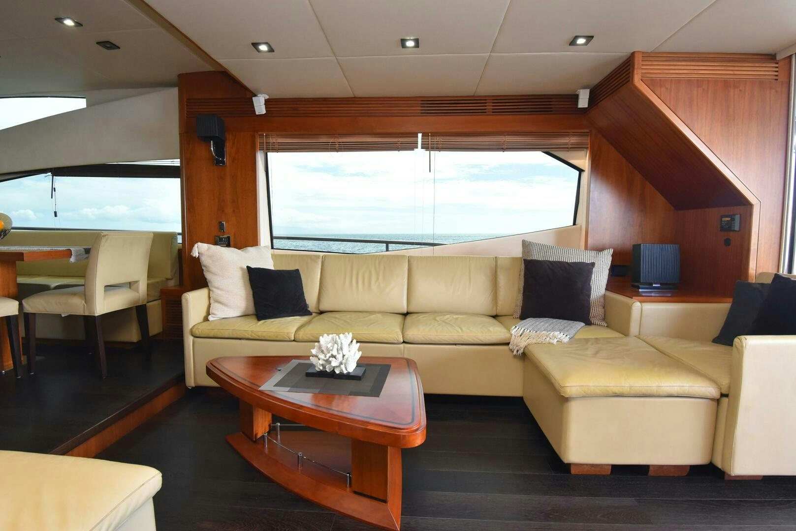 a living room with a couch and a coffee table aboard SAVI II  Yacht for Sale