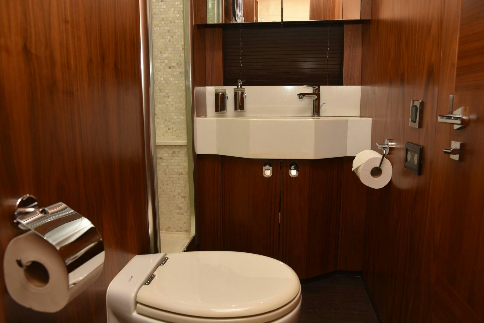 a bathroom with a toilet and a sink aboard SAVI II  Yacht for Sale