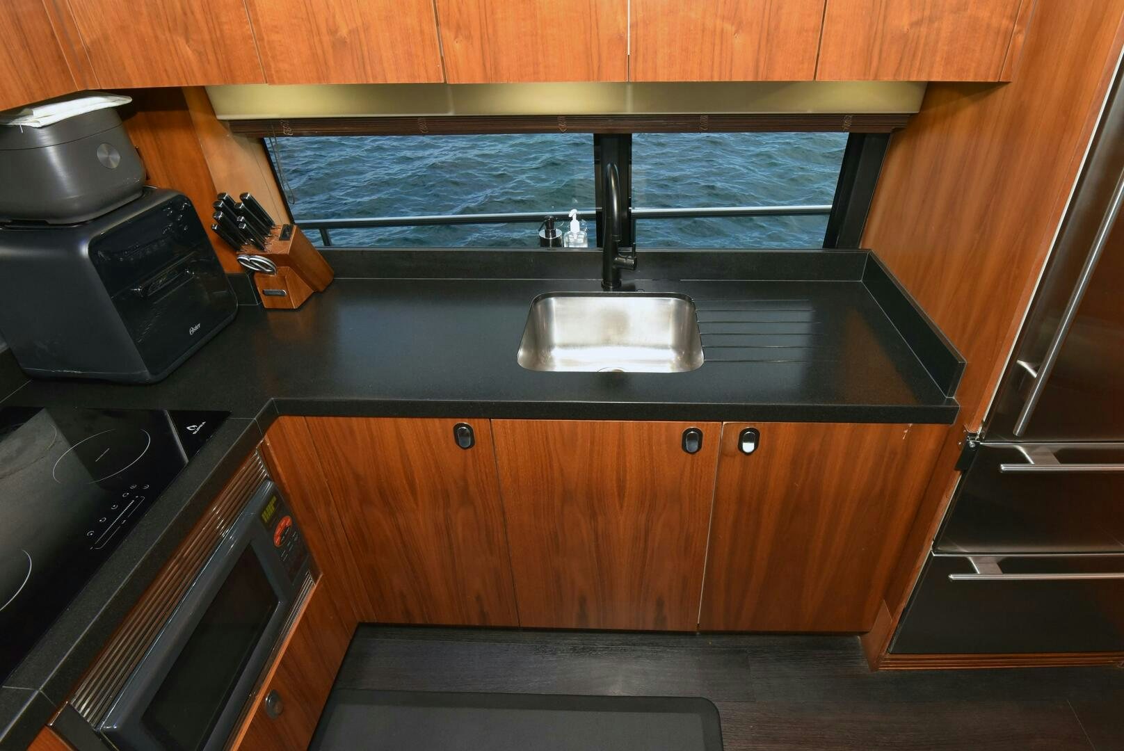 a kitchen with a sink and a stove aboard SAVI II  Yacht for Sale