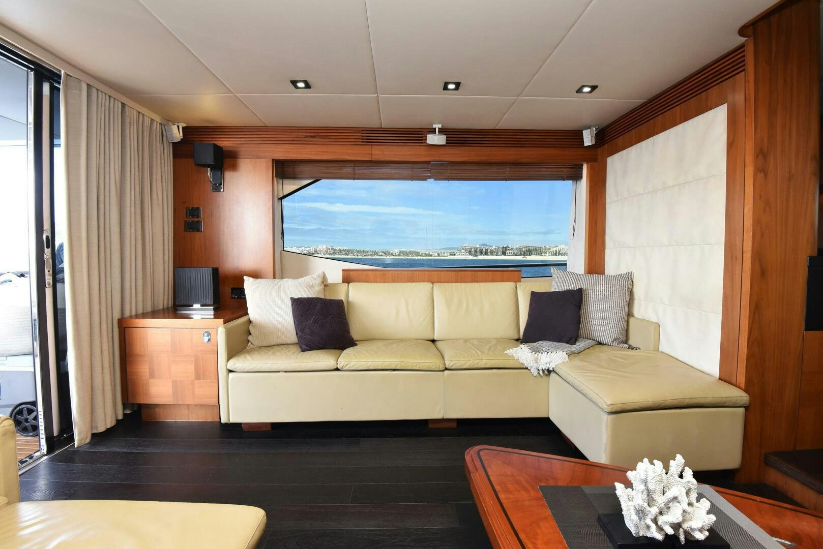 a living room with a large window aboard SAVI II  Yacht for Sale