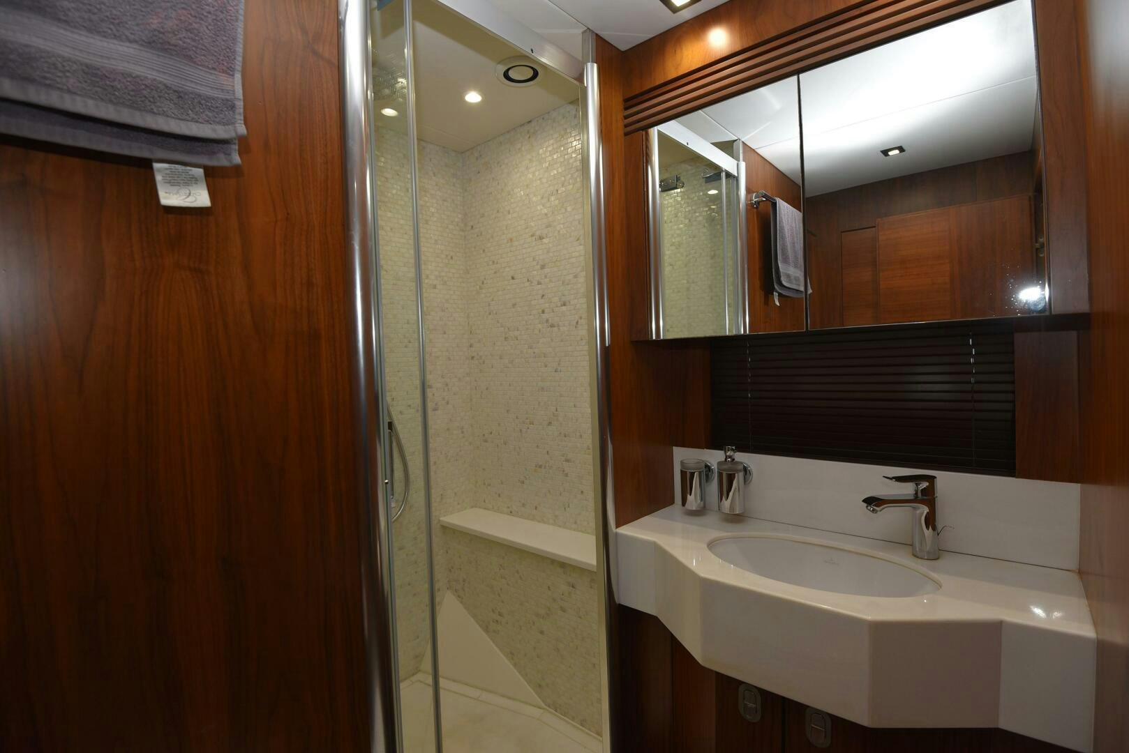 a bathroom with a sink and a shower aboard SAVI II  Yacht for Sale