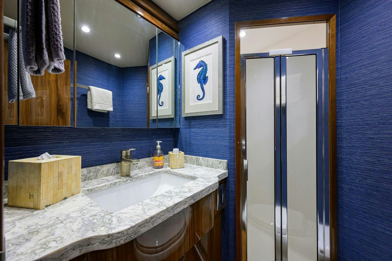 a bathroom with a large mirror aboard TAMI ANN Yacht for Sale