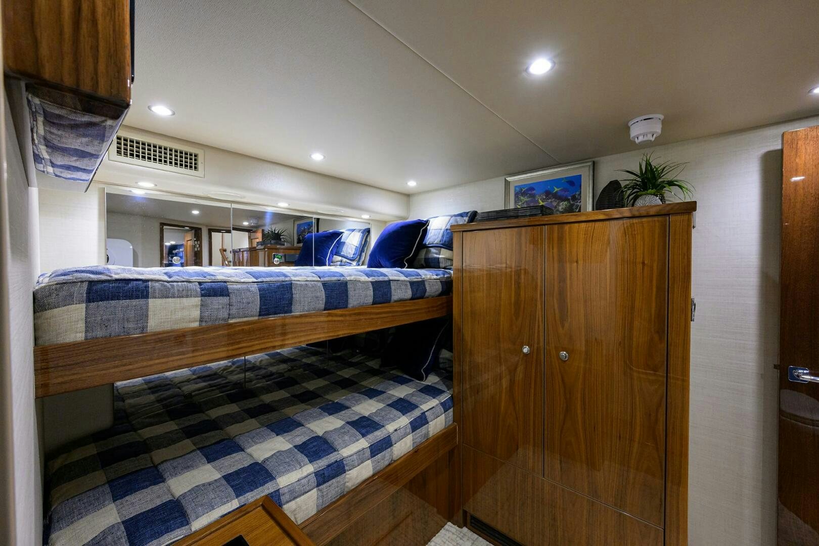a bedroom with a bed and a desk aboard TAMI ANN Yacht for Sale