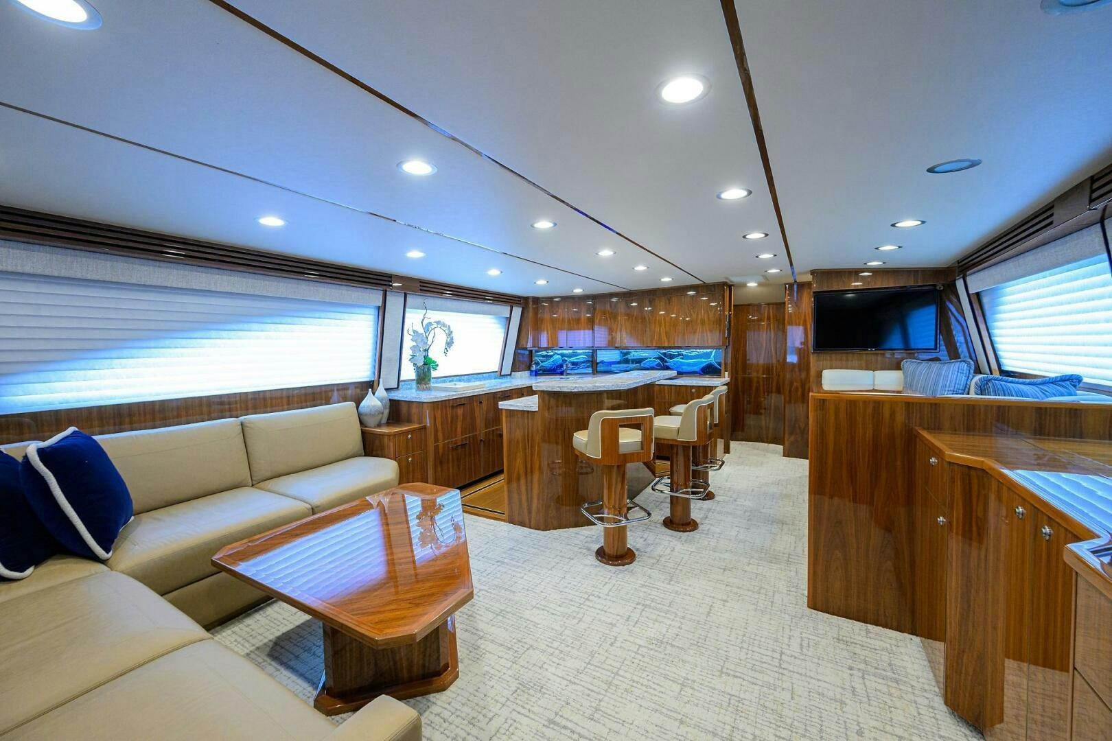 a large room with a couch and a table aboard TAMI ANN Yacht for Sale