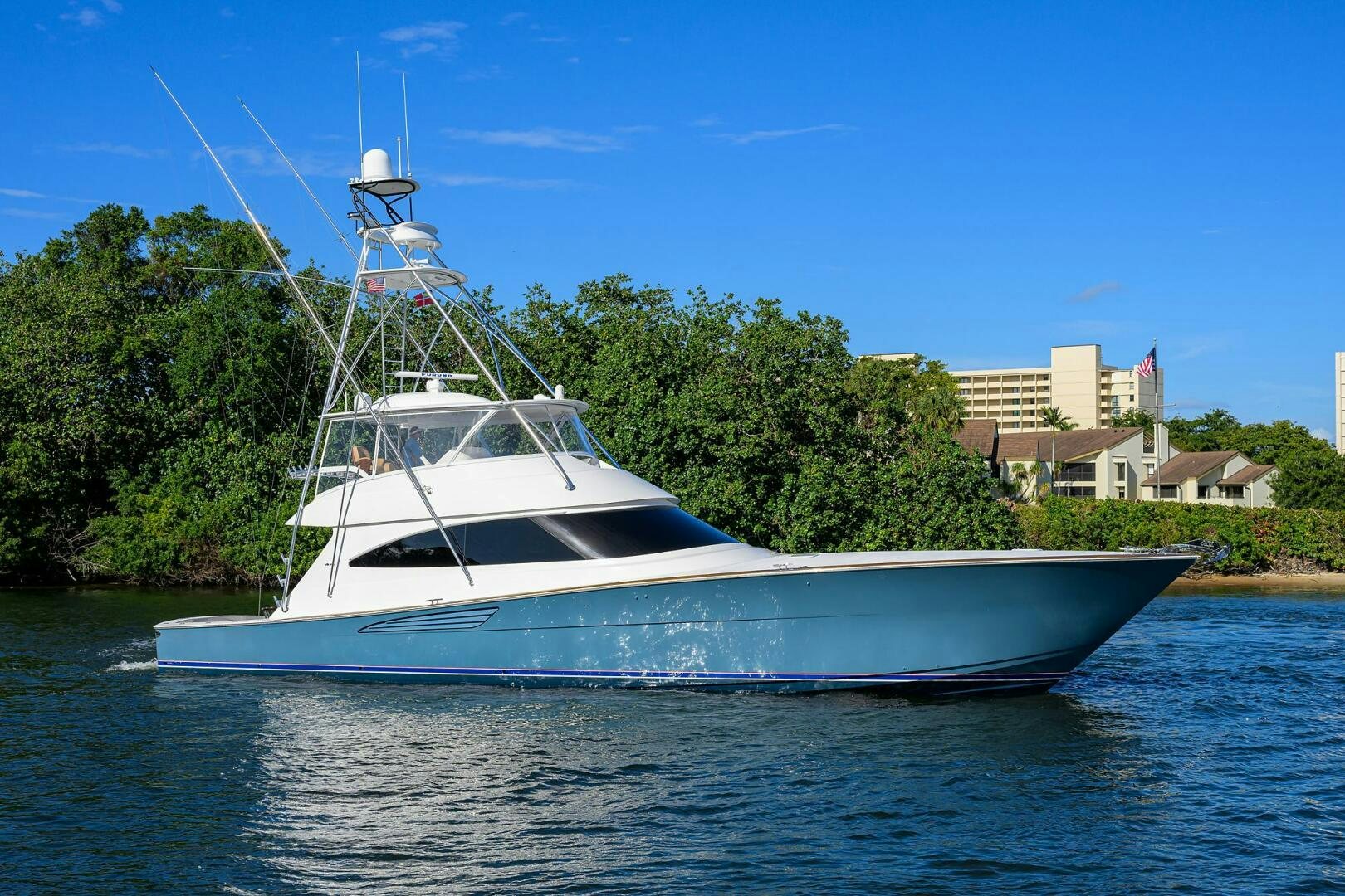 a white boat on water aboard TAMI ANN Yacht for Sale