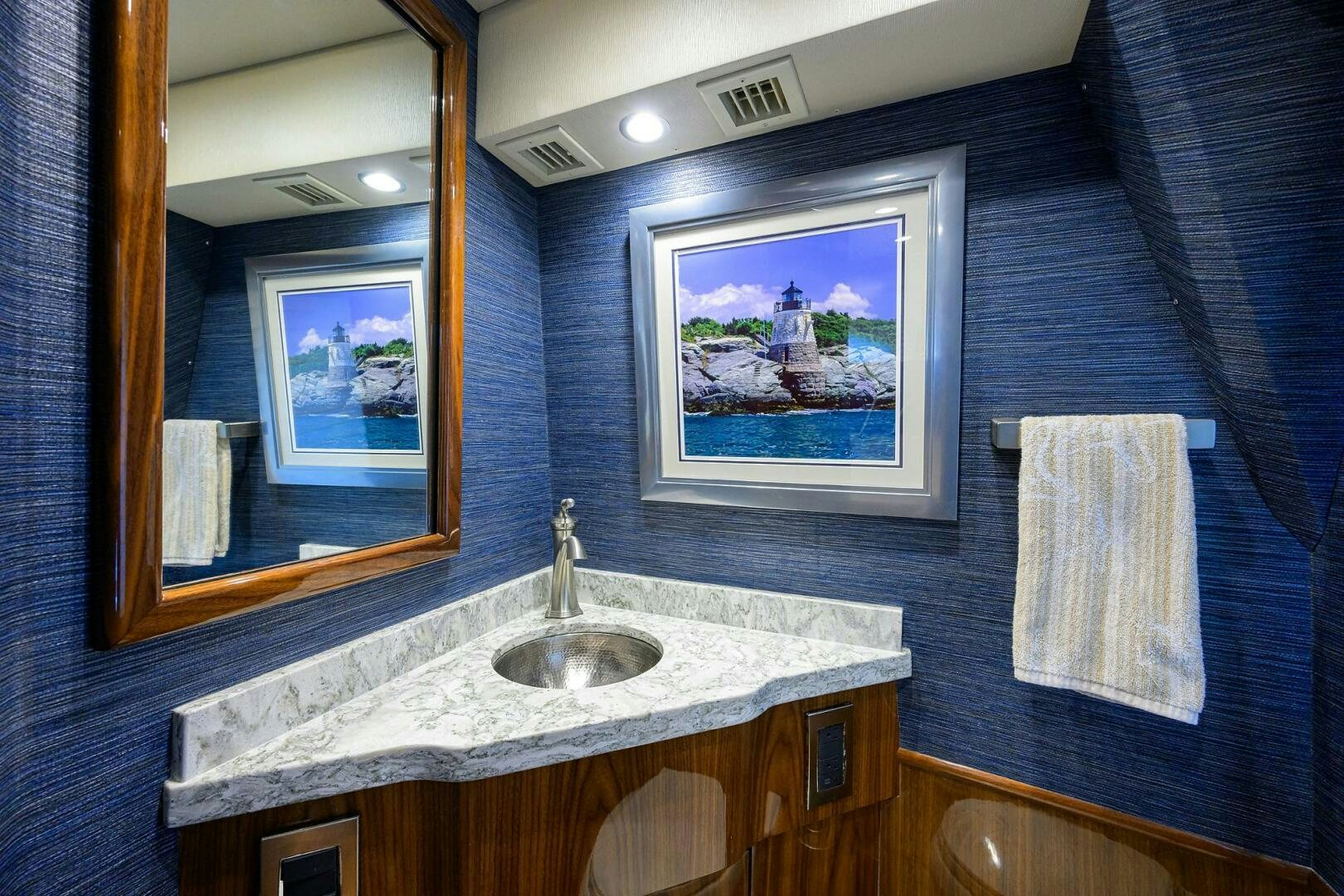 a bathroom with a sink and a mirror aboard TAMI ANN Yacht for Sale
