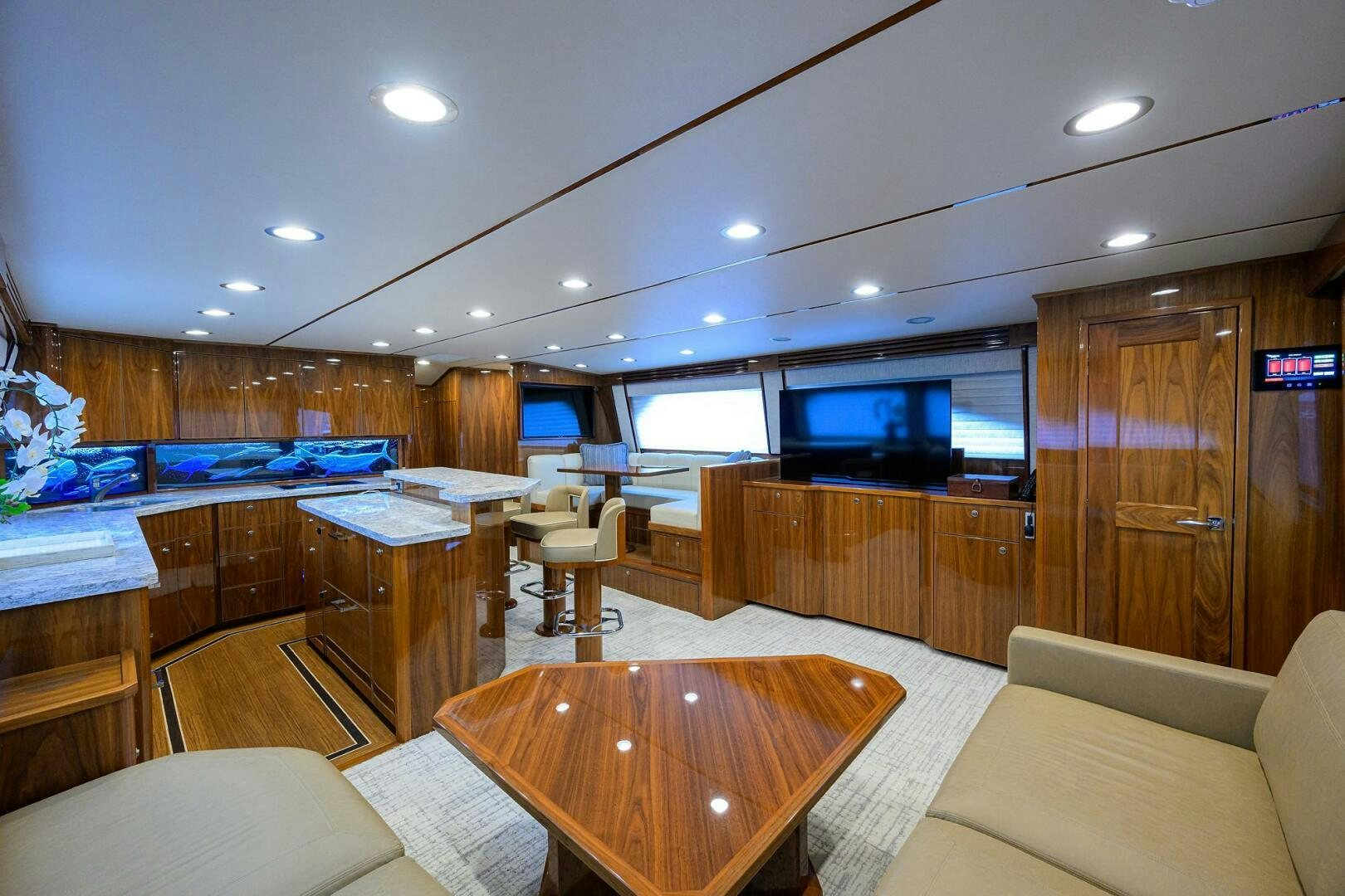 a room with a table and chairs aboard TAMI ANN Yacht for Sale