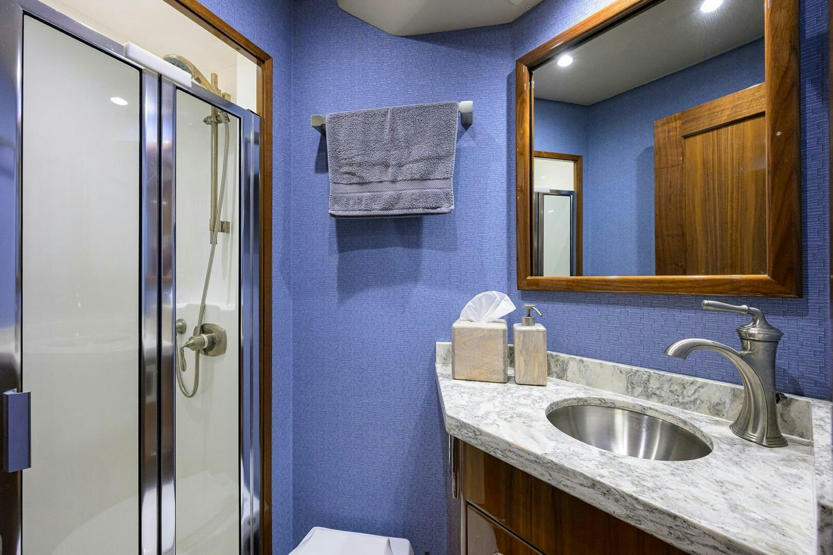 a bathroom with a sink and a mirror aboard TAMI ANN Yacht for Sale