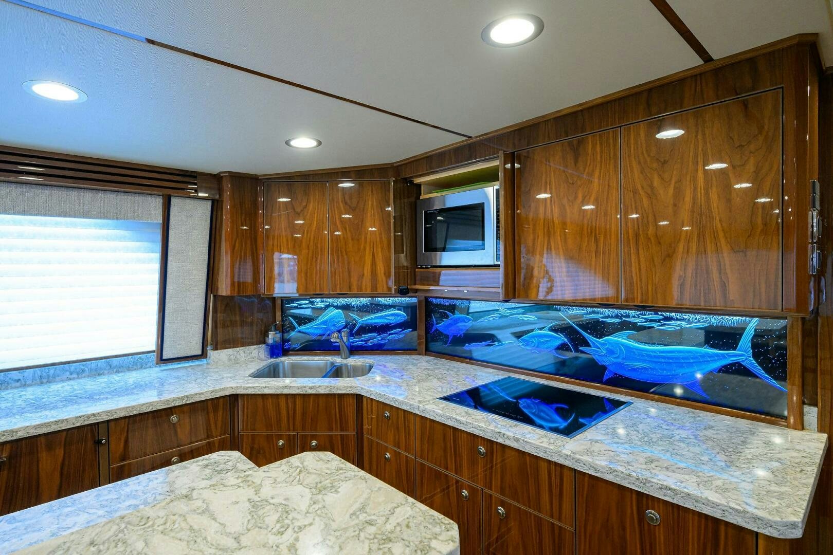 a kitchen with wooden cabinets aboard TAMI ANN Yacht for Sale