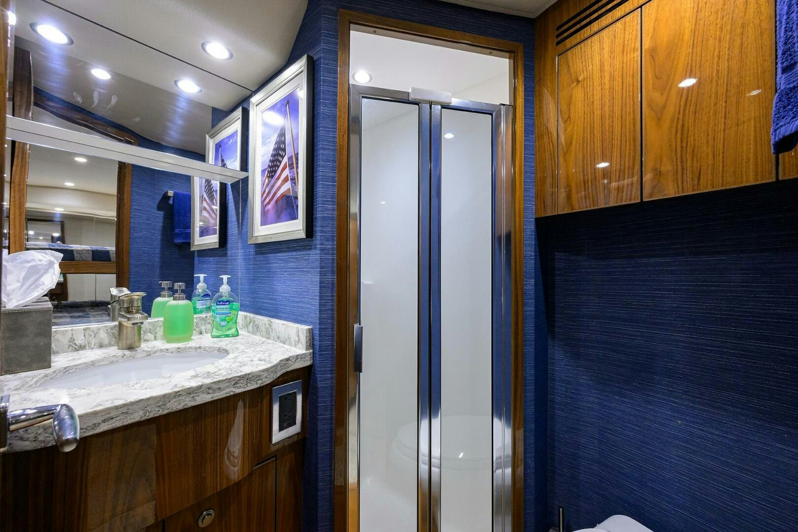 a bathroom with a glass door aboard TAMI ANN Yacht for Sale