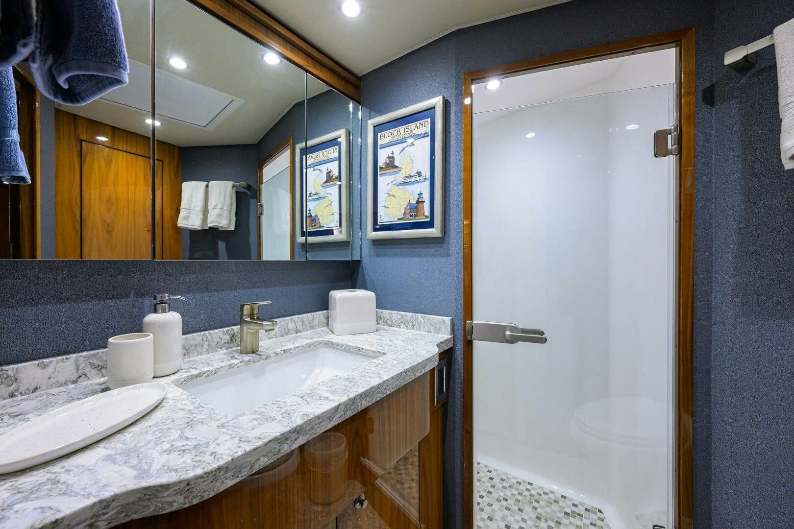 a bathroom with a countertop sink and mirror aboard TAMI ANN Yacht for Sale