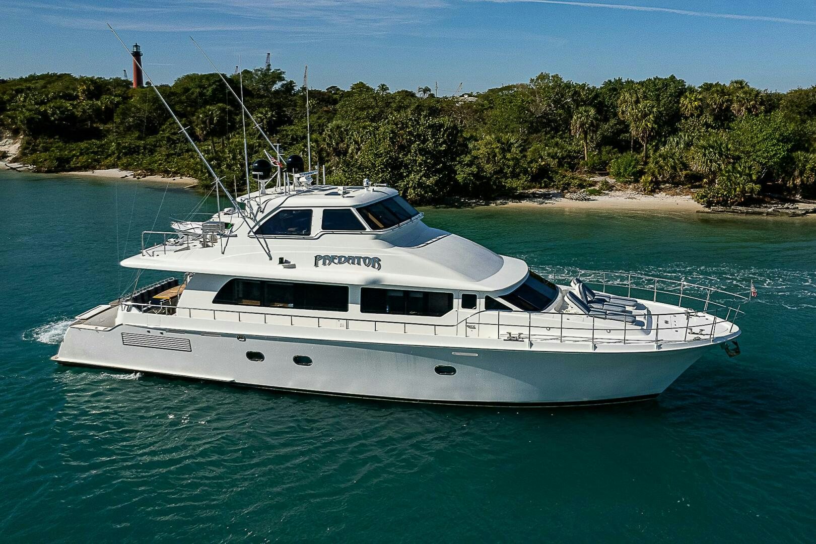 a white yacht in the water aboard PREDATOR Yacht for Sale