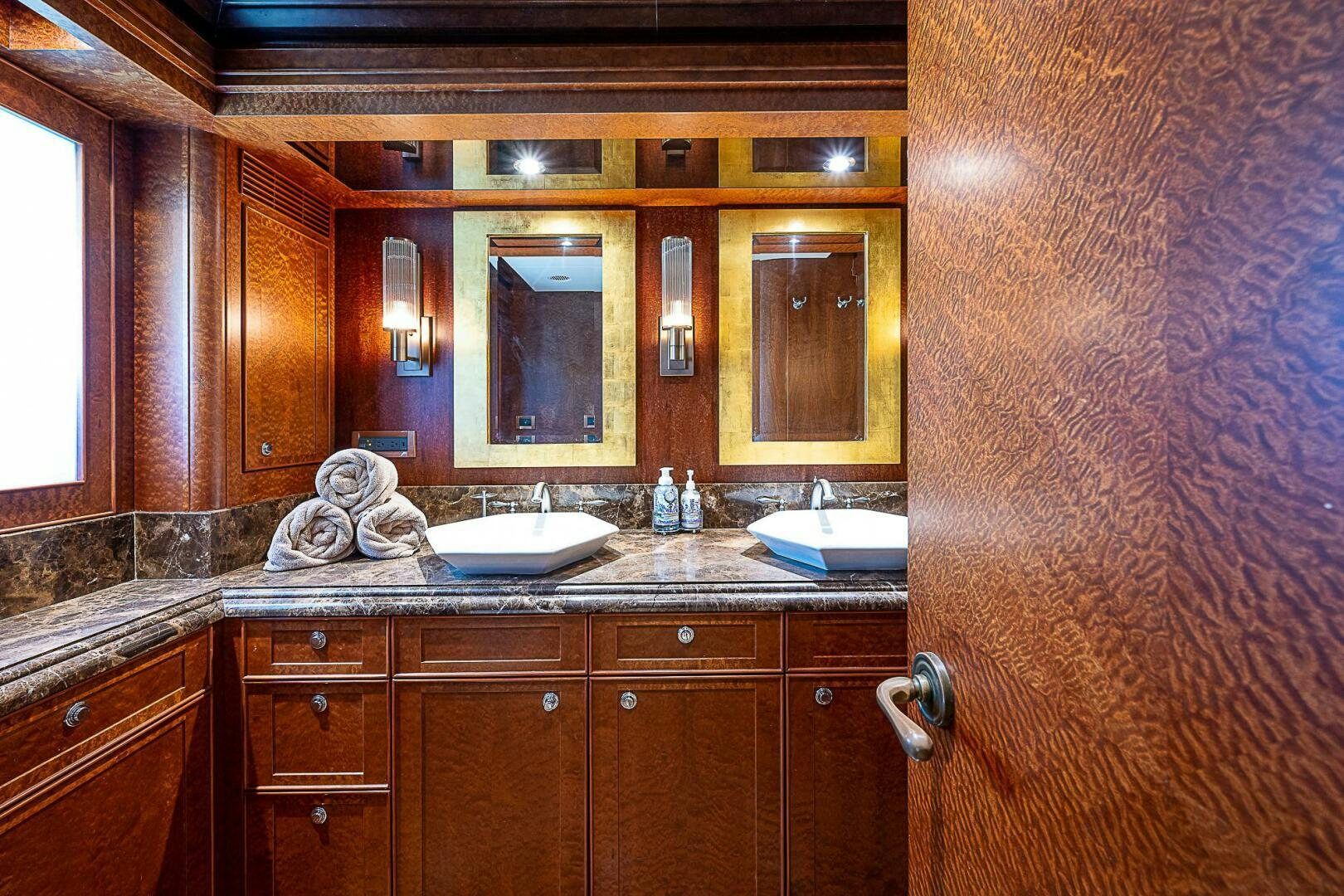 a bathroom with a sink and a mirror aboard PREDATOR Yacht for Sale