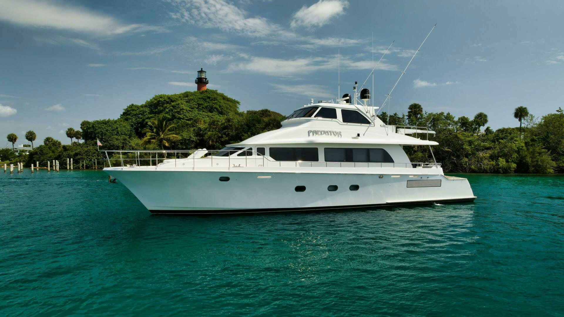 a white boat in the water aboard PREDATOR Yacht for Sale