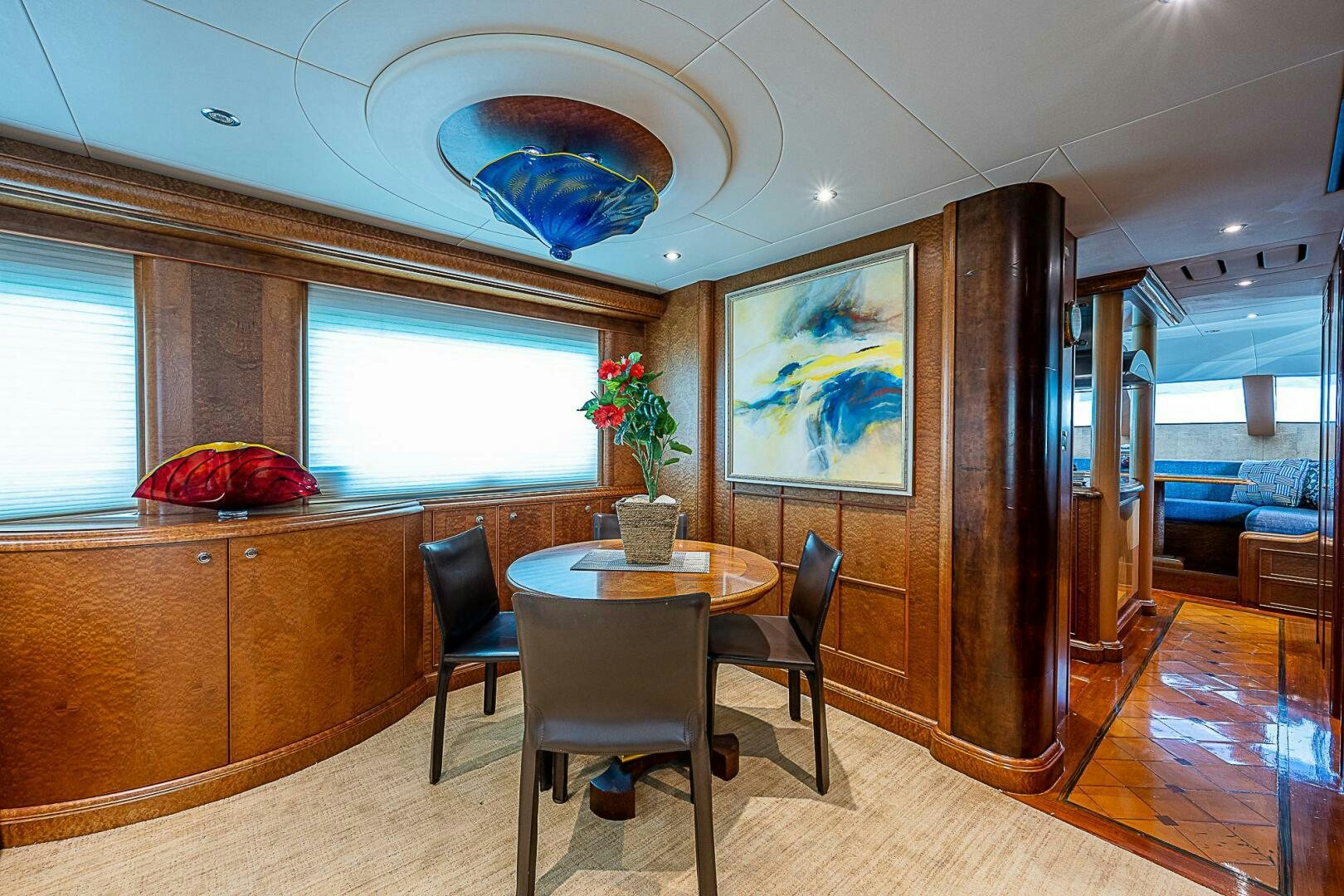a room with a table and chairs aboard PREDATOR Yacht for Sale