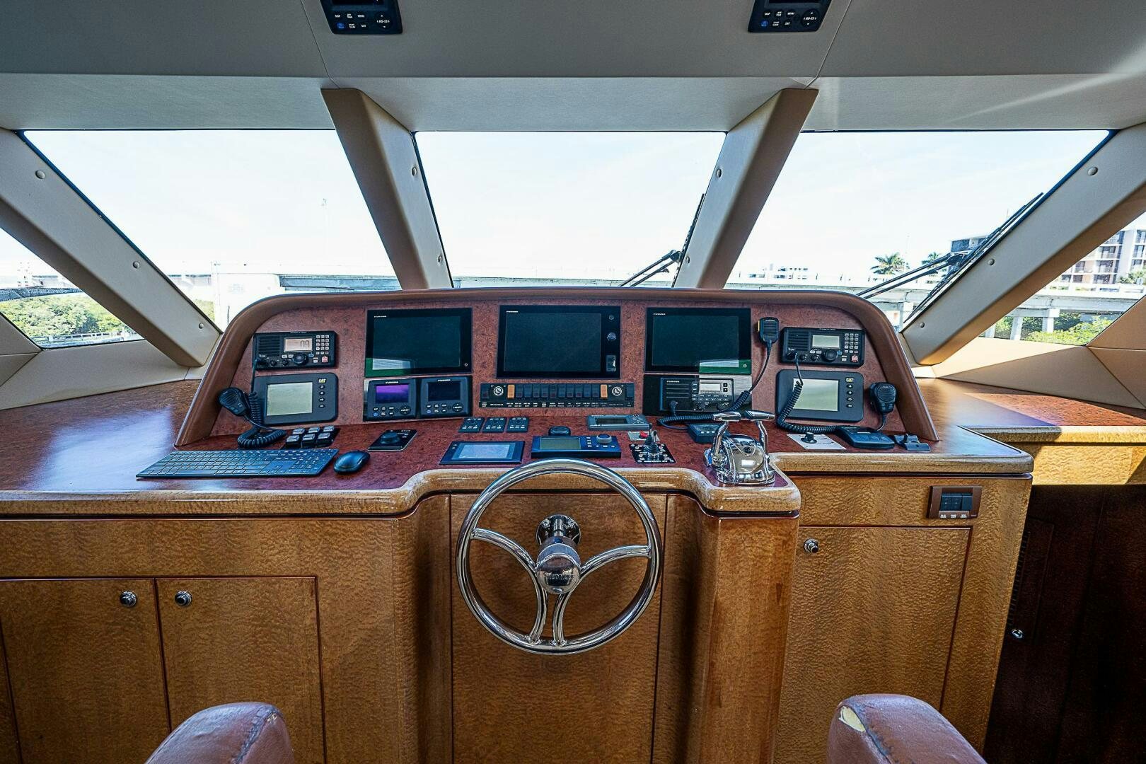 a table with a couple of laptops on it aboard PREDATOR Yacht for Sale