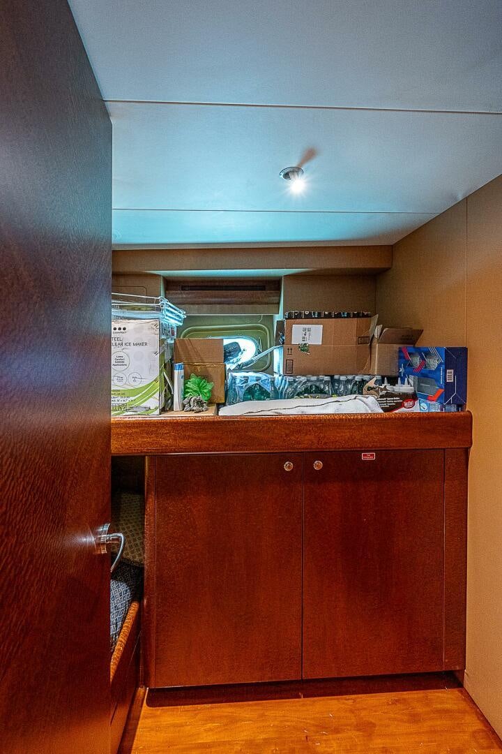 a kitchen with a sink and cabinets aboard PREDATOR Yacht for Sale