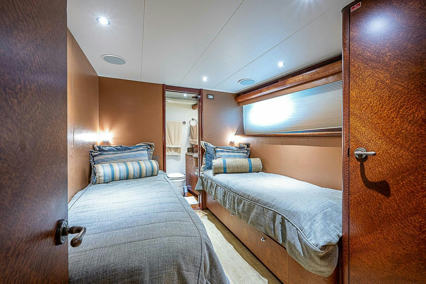 a couple of beds in a room aboard PREDATOR Yacht for Sale