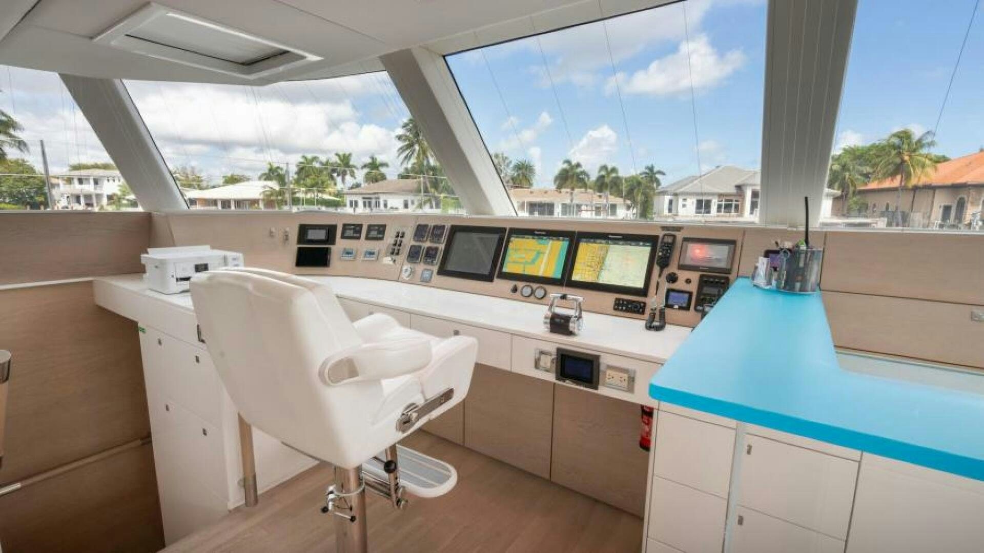 a white chair in a room aboard WILDBERRY Yacht for Sale