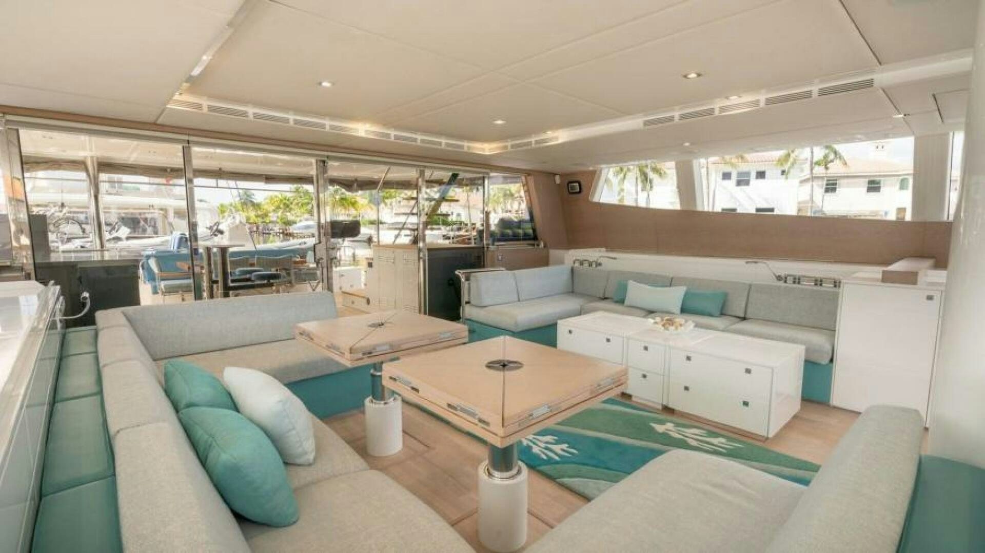 a living room with a couch and a table aboard WILDBERRY Yacht for Sale