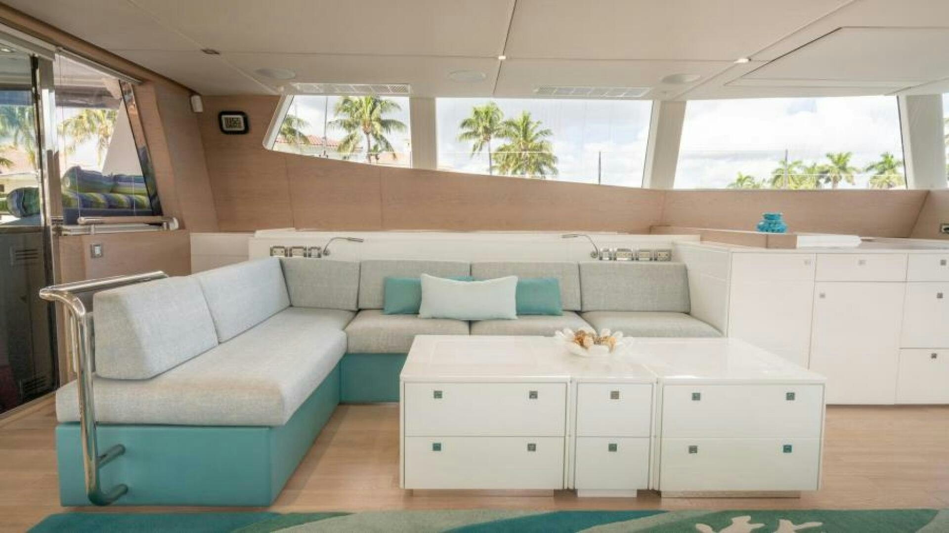 a white couch in a room aboard WILDBERRY Yacht for Sale