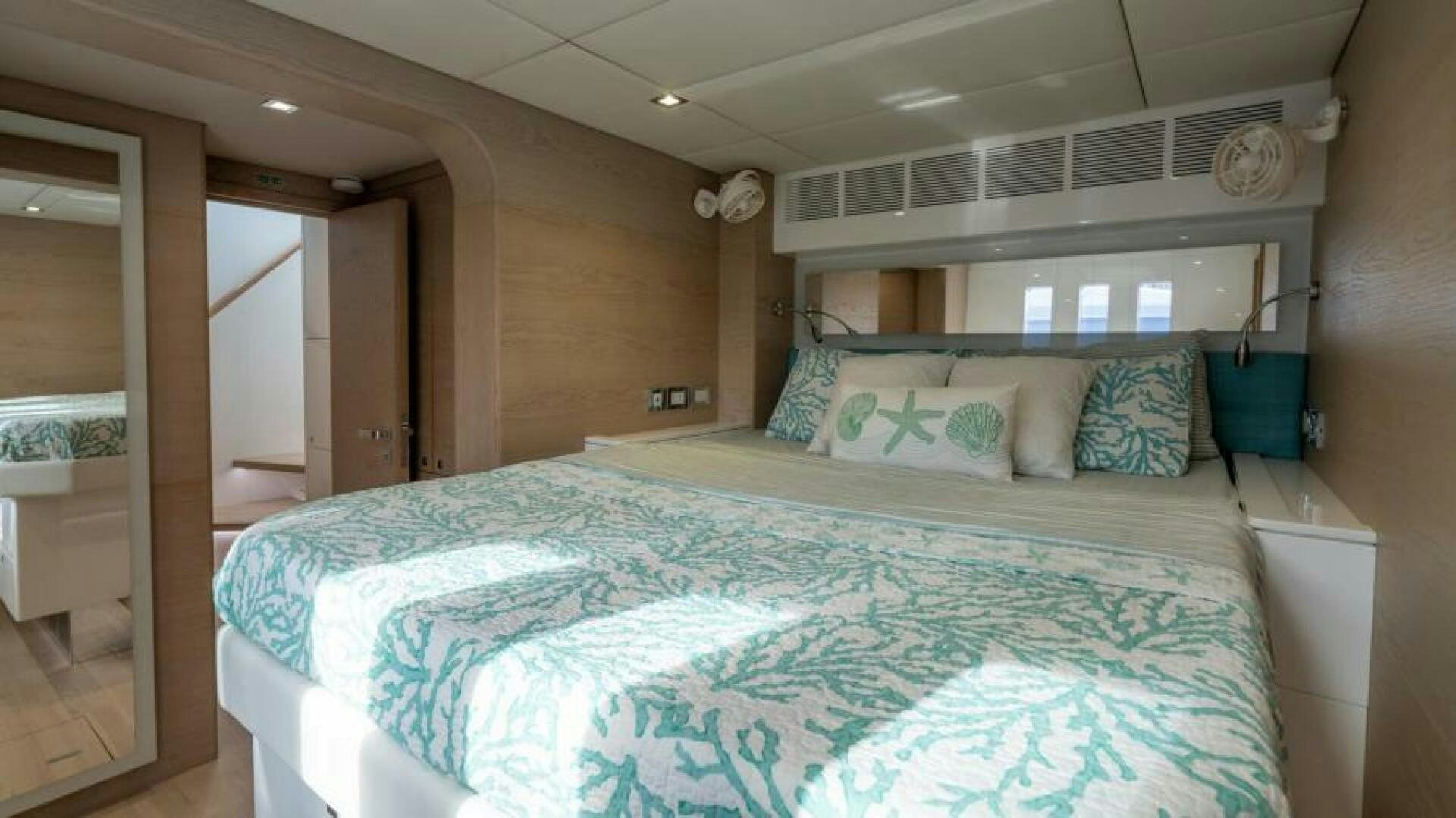a bed in a room aboard WILDBERRY Yacht for Sale