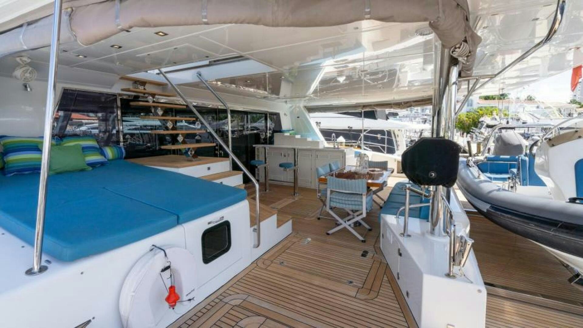 a room with a large bed and a chair aboard WILDBERRY Yacht for Sale