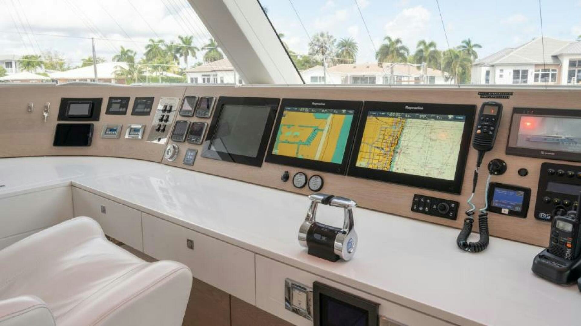 a room with a large screen and a few screens aboard WILDBERRY Yacht for Sale