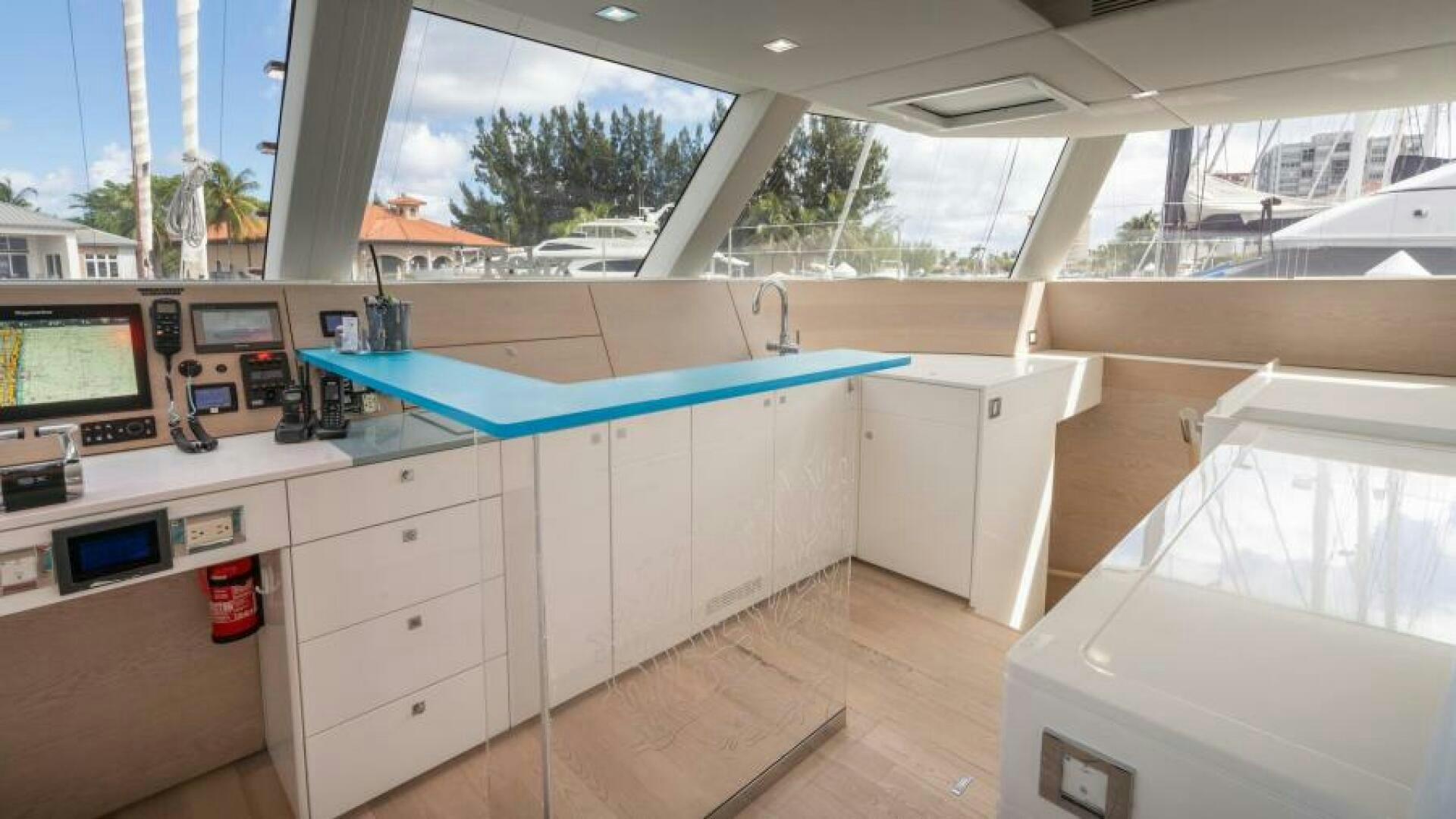 a room with a pool table and a deck with a pool aboard WILDBERRY Yacht for Sale