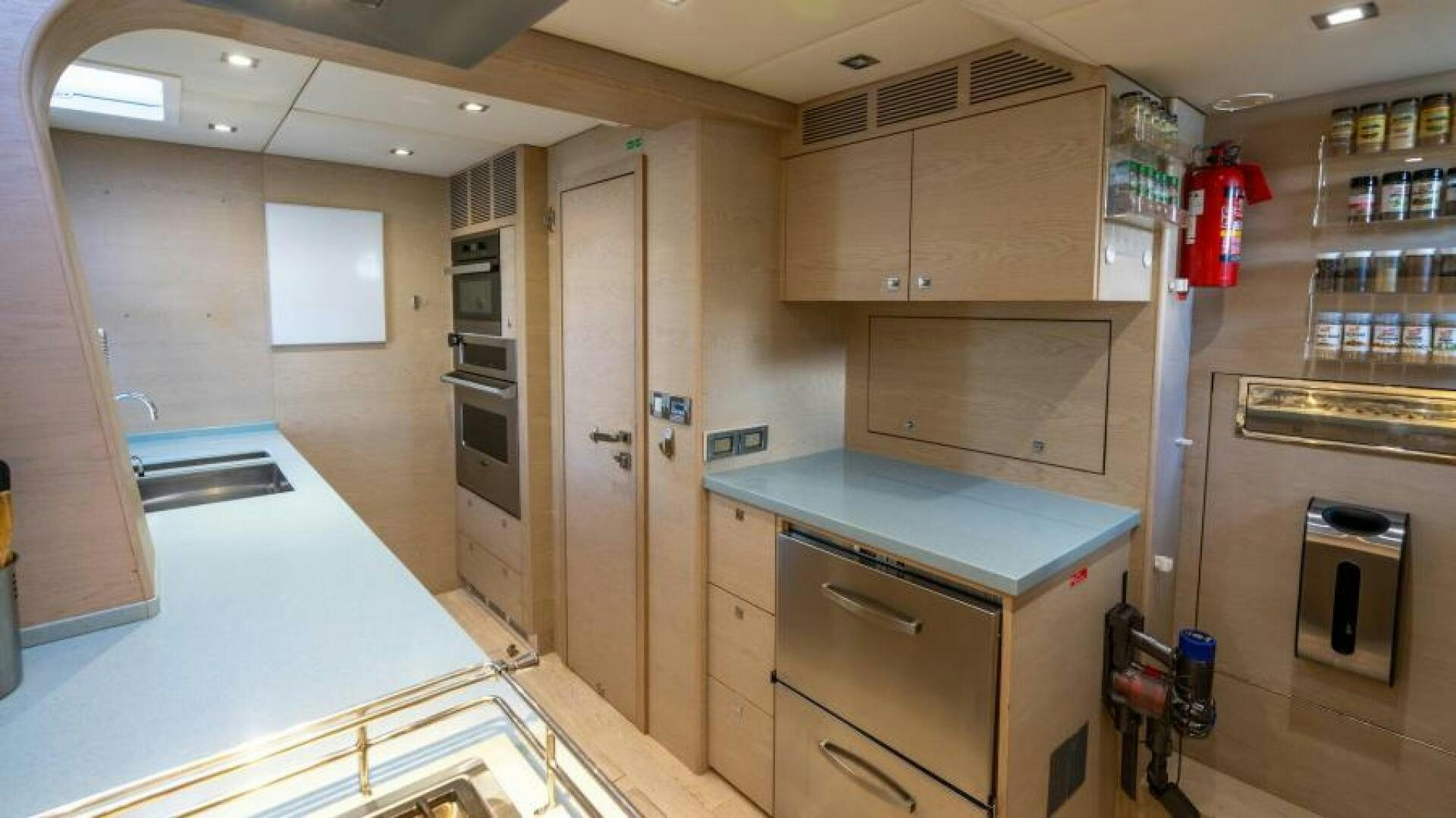 a kitchen with a counter and cabinets aboard WILDBERRY Yacht for Sale