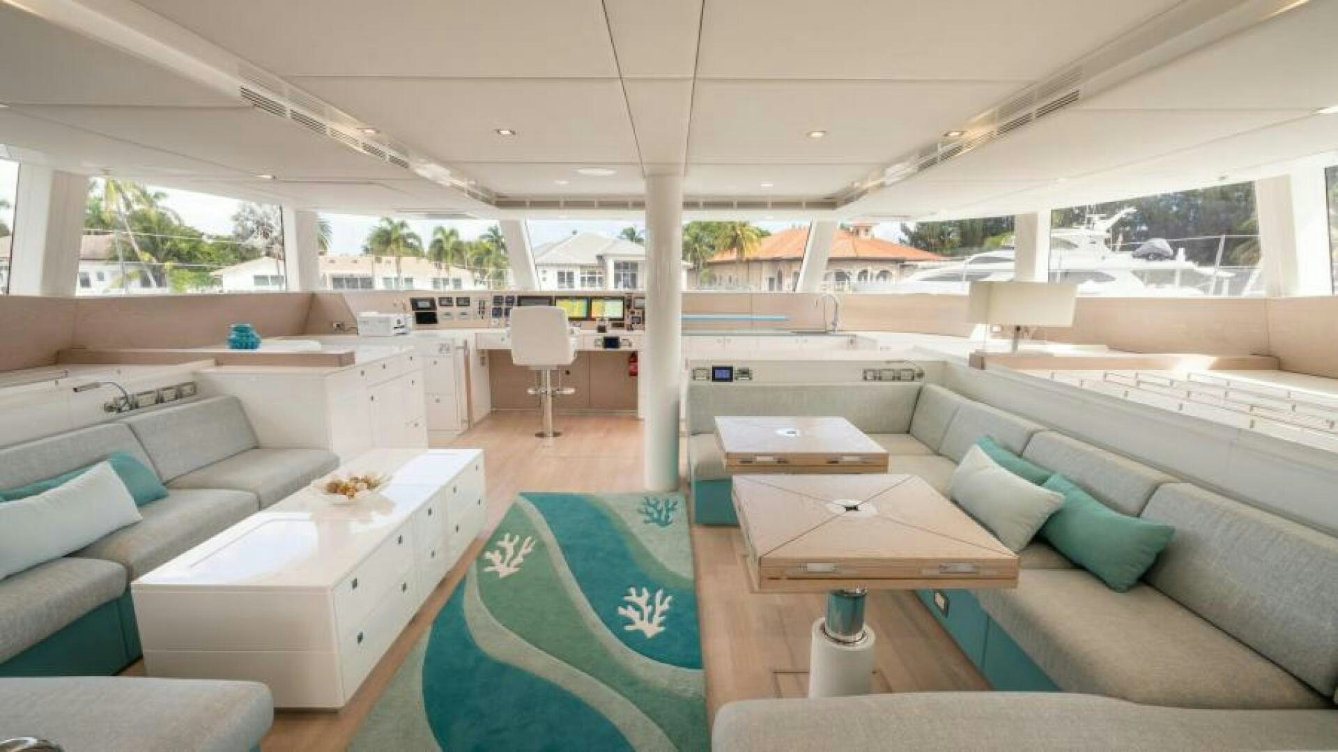 a room with a couch and a table aboard WILDBERRY Yacht for Sale