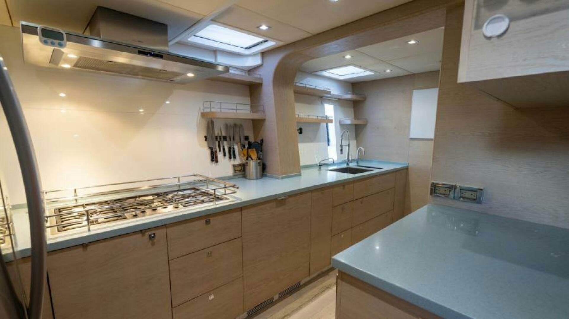 a kitchen with a large island aboard WILDBERRY Yacht for Sale