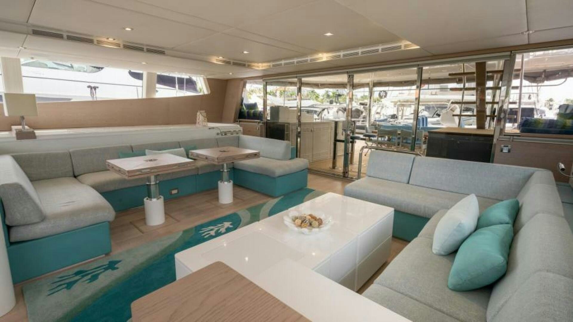 a room with a couch and a table aboard WILDBERRY Yacht for Sale