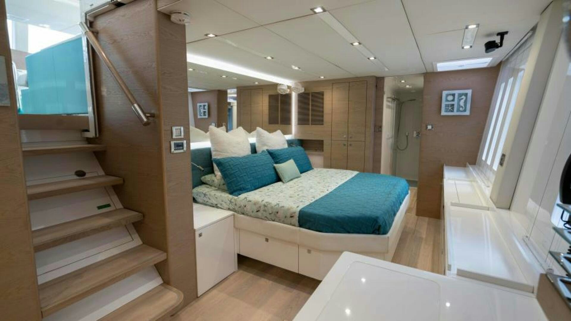 a bed in a room aboard WILDBERRY Yacht for Sale