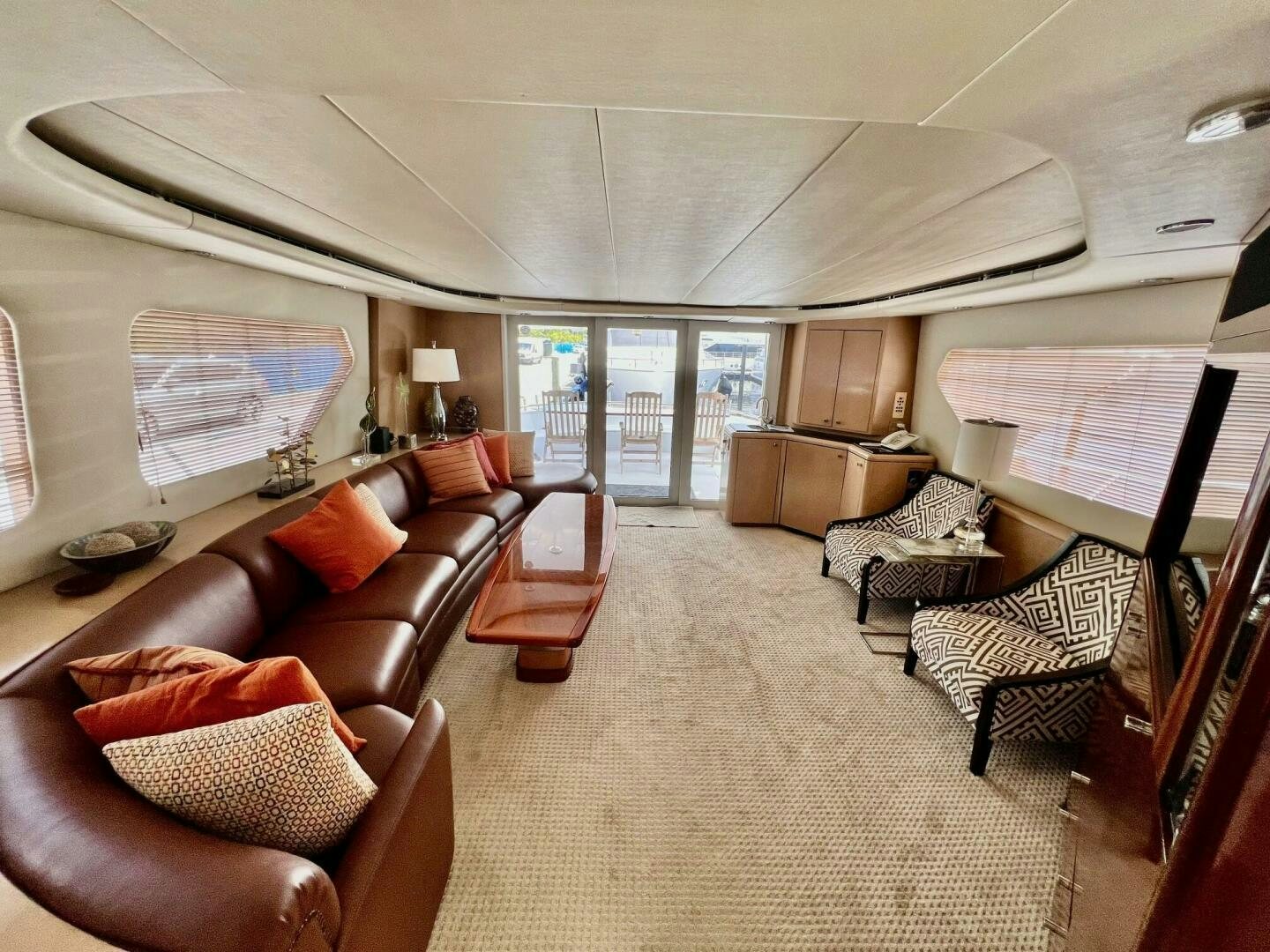 a living room with a large window aboard SEAQUEST Yacht for Sale