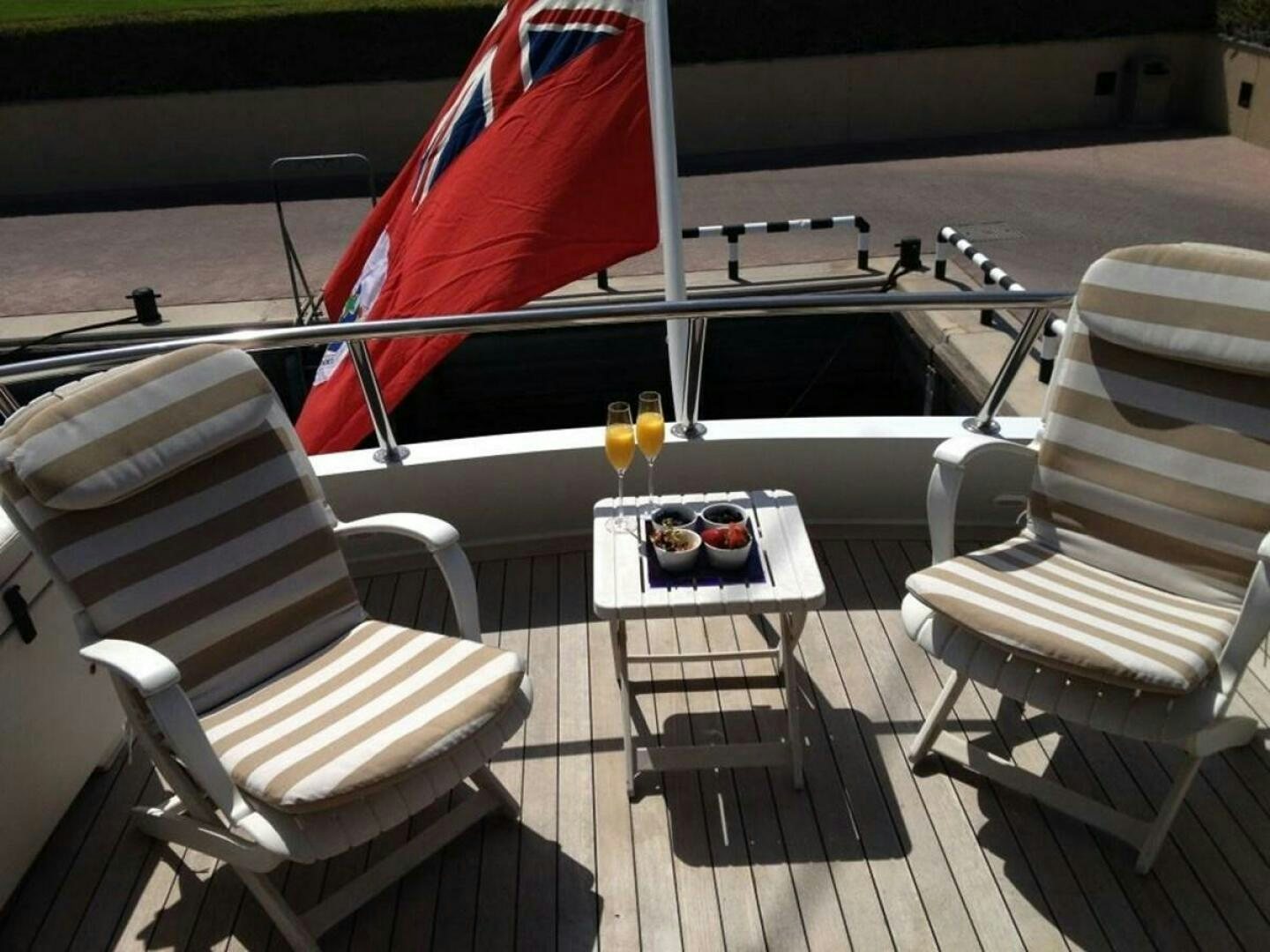 a table and chairs on a deck aboard SEAQUEST Yacht for Sale