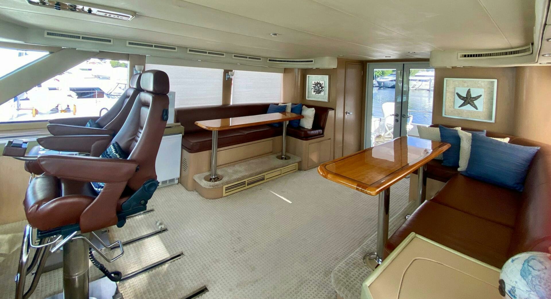 a room with a table and chairs aboard SEAQUEST Yacht for Sale