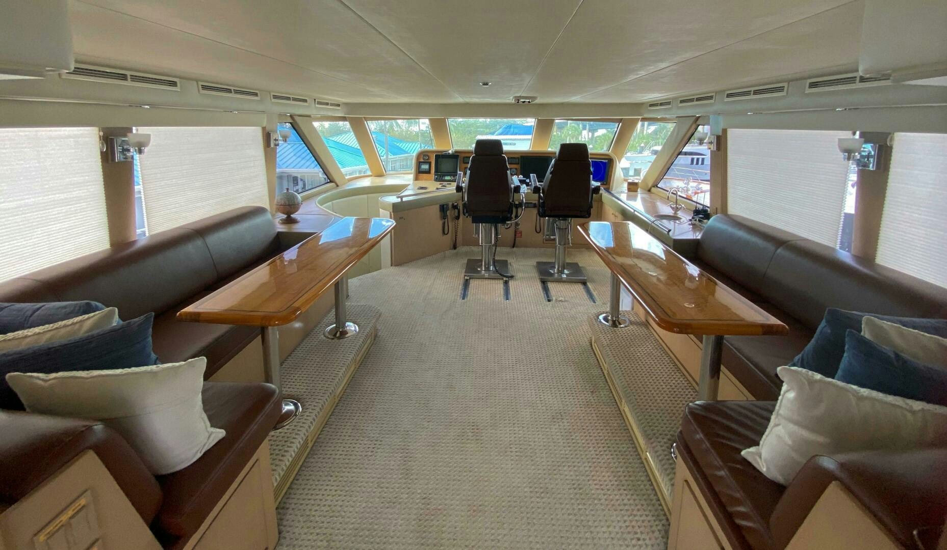 inside of a vehicle with chairs and desks aboard SEAQUEST Yacht for Sale