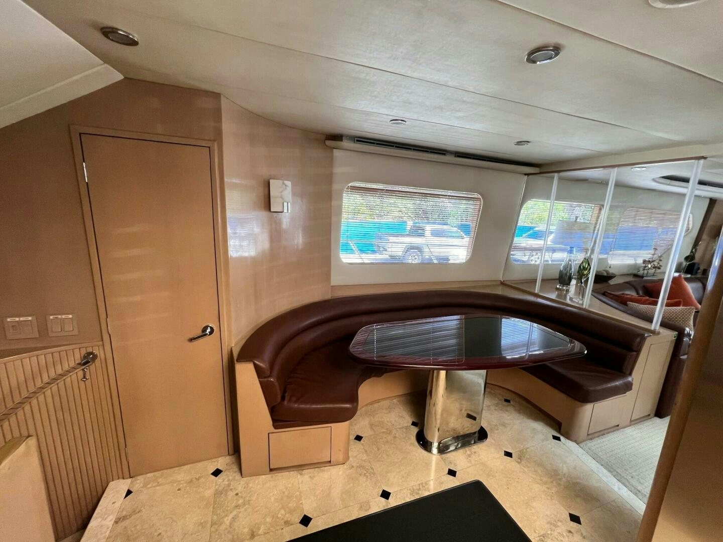 a room with a table and a couch aboard SEAQUEST Yacht for Sale