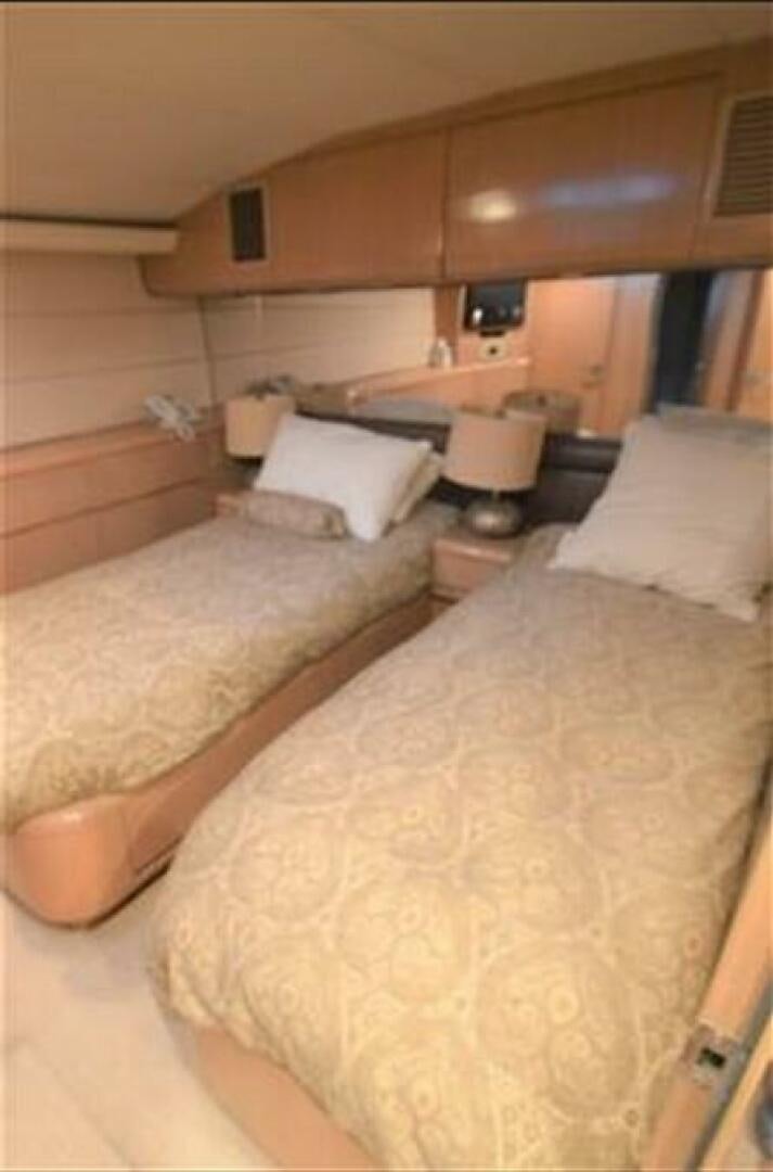 a couple of beds in a room aboard SEAQUEST Yacht for Sale