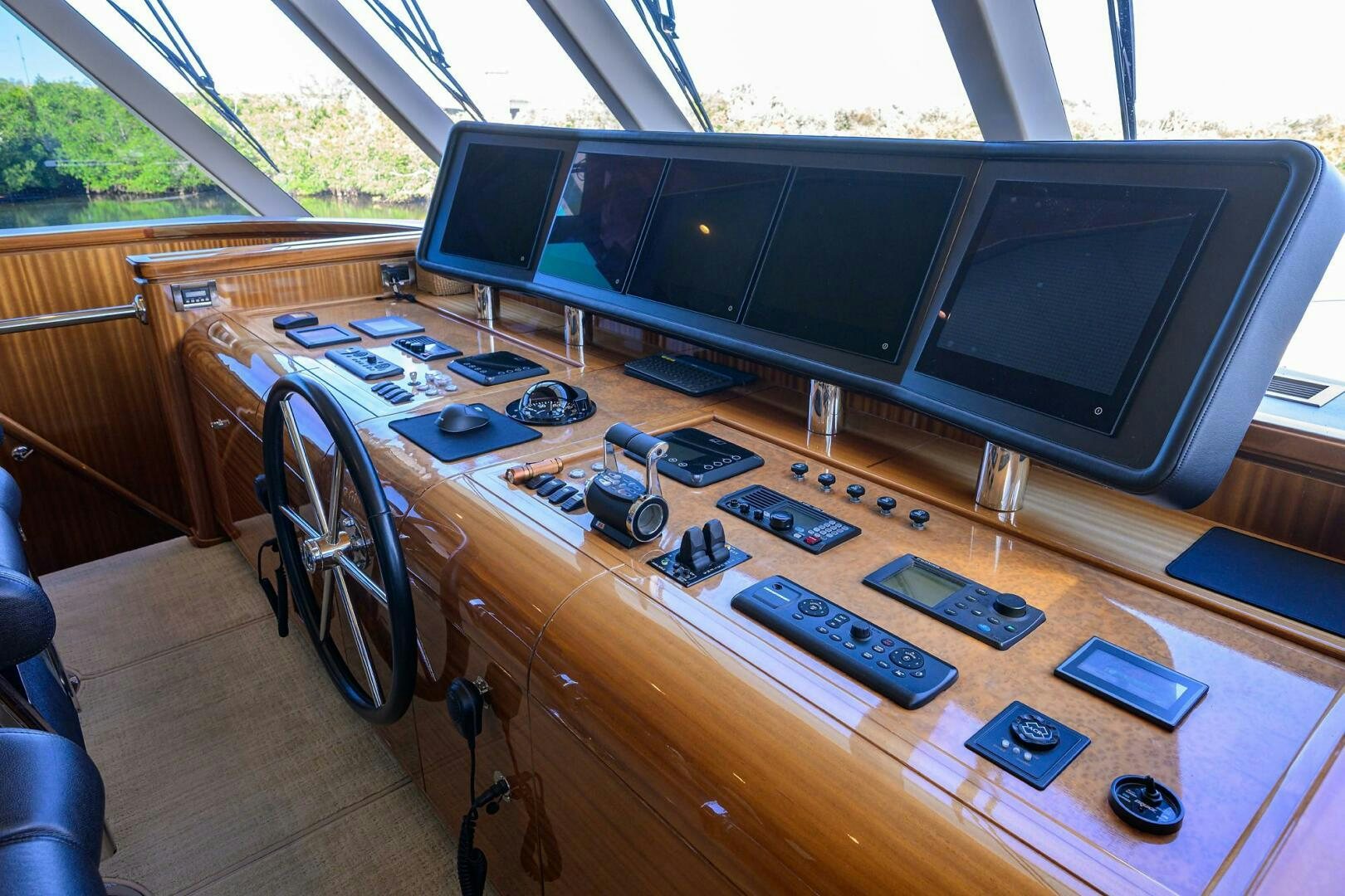 a room with a large tv and many electronics on a table aboard JANE E Yacht for Sale