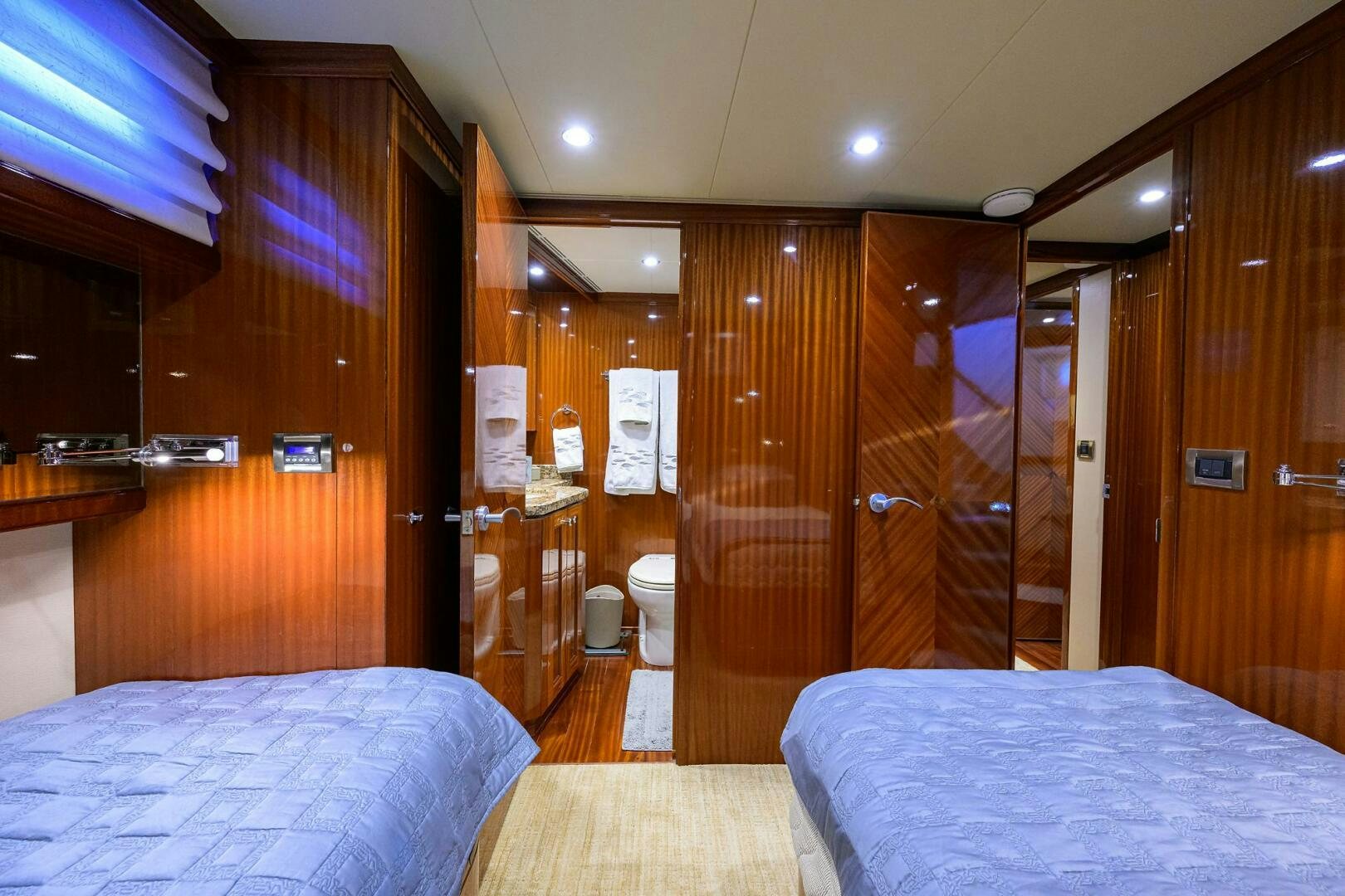 a hotel room with a bed and a shower aboard JANE E Yacht for Sale