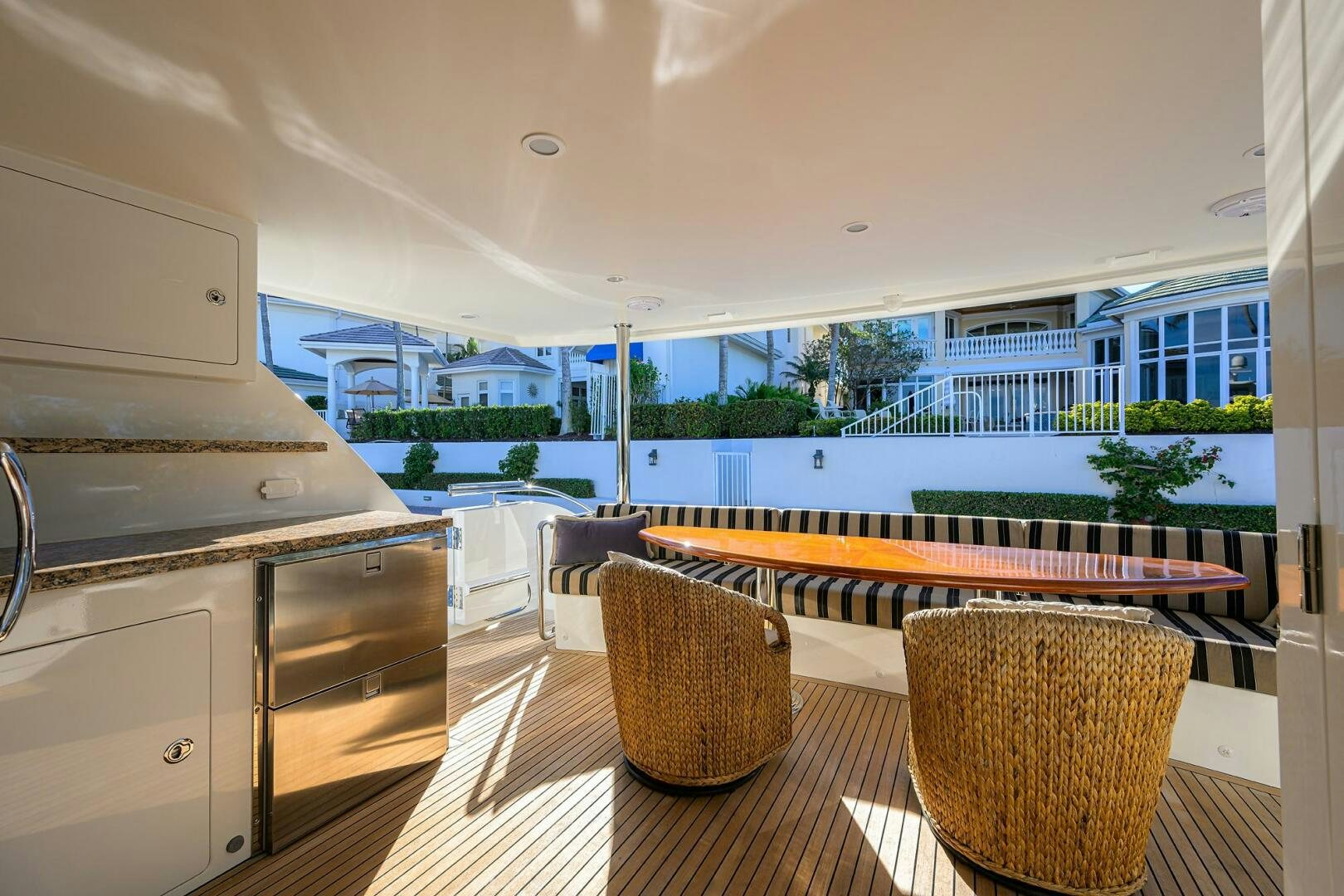 a room with a table and chairs aboard JANE E Yacht for Sale