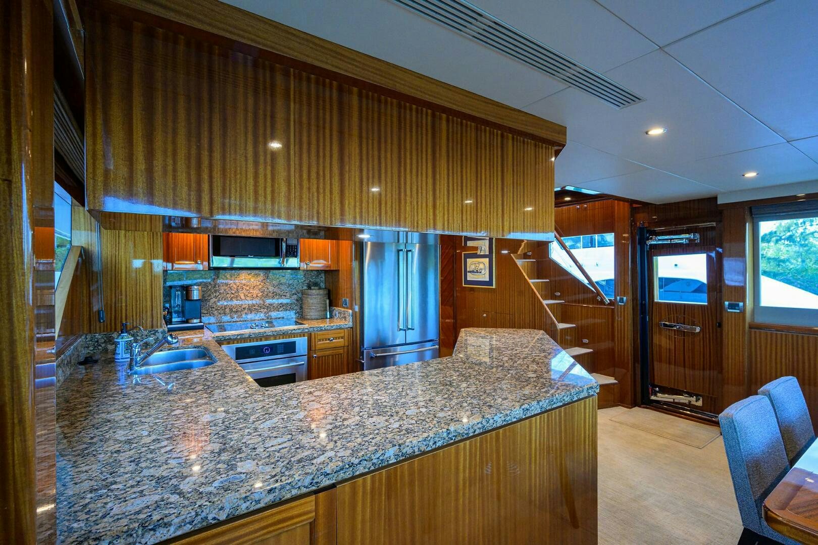a large kitchen with marble counter tops aboard JANE E Yacht for Sale