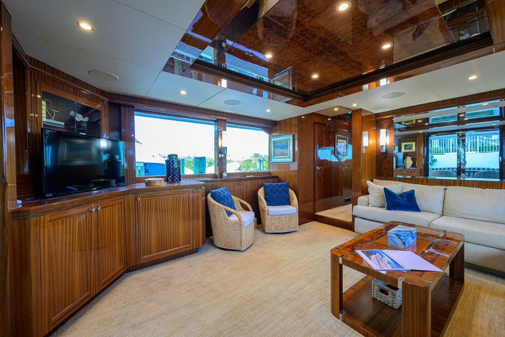 a large living room with a kitchen and dining area aboard JANE E Yacht for Sale